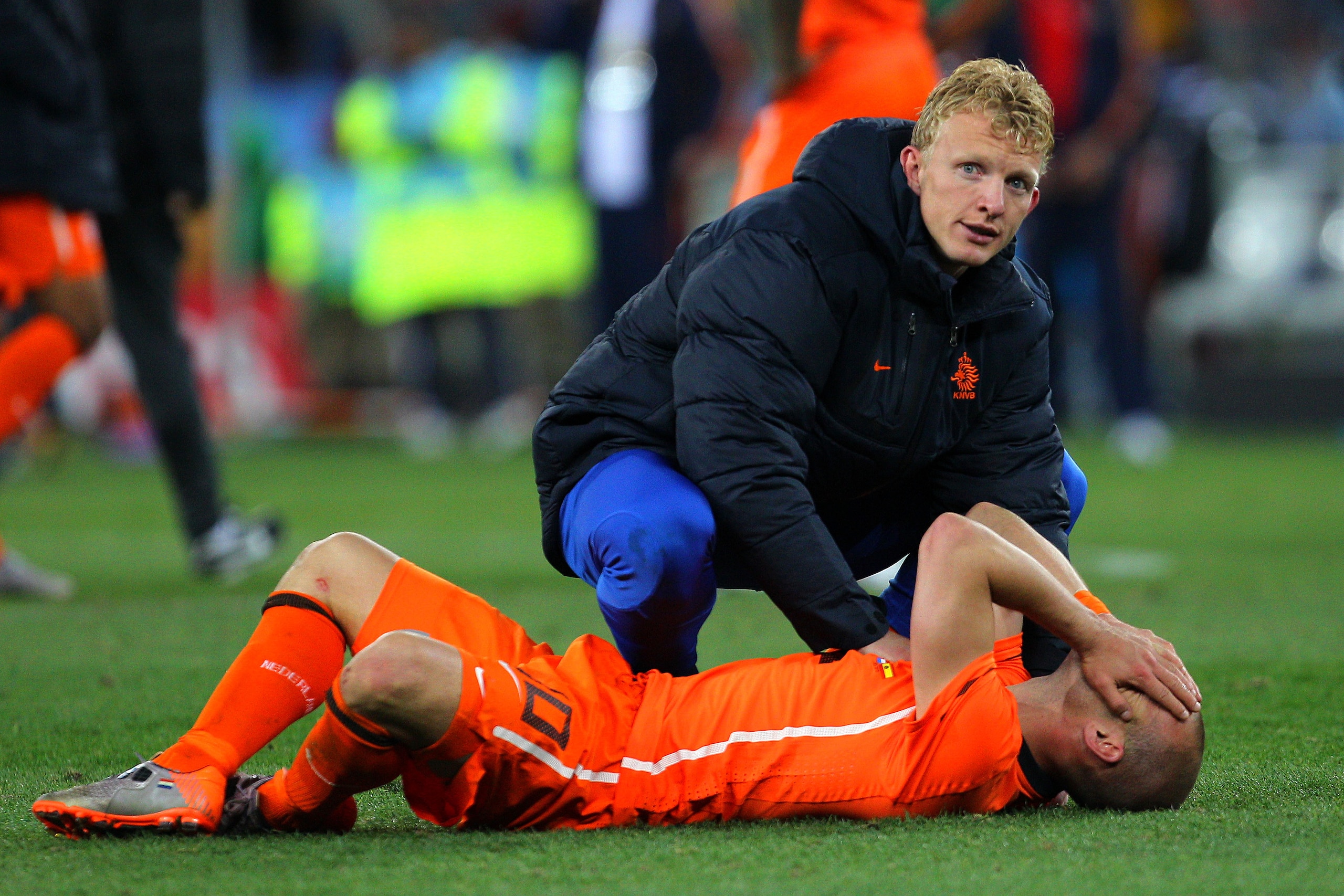 JOHANNESBURG, SOUTH AFRICA - JULY 11: Dejected Wesley Sneijder of the Netherlands lies on the pitch as he is consoled by team mate Dirk Kuyt after defeat during the 2010 FIFA World Cup South Africa Final match between Netherlands and Spain at Soccer Cit JOHANNESBURG, SOUTH AFRICA - JULY 11: Dejected Wesley Sneijder of the Netherlands lies on the pitch as he is consoled by team mate Dirk Kuyt after defeat during the 2010 FIFA World Cup South Africa Final match between Netherlands and Spain at Soccer Cit