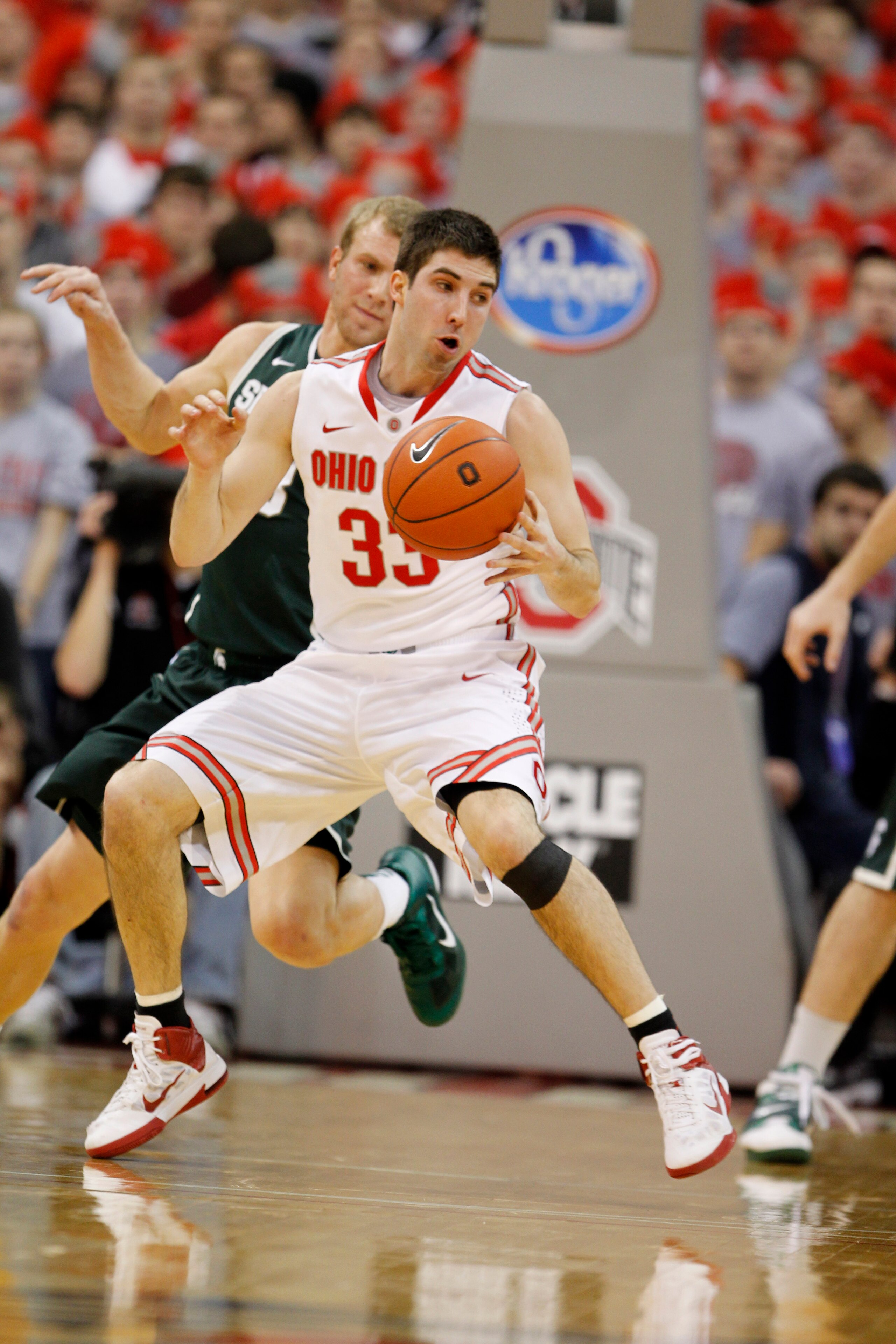 COLUMBUS, OH - FEBRUARY 15:  Jon Diebler #33 of the Ohio State Buckeyes controls the ball while playing the Michigan State Spartans on February 15, 2011 at Value City Arena in Columbus, Ohio.  (Photo by Gregory Shamus/Getty Images)