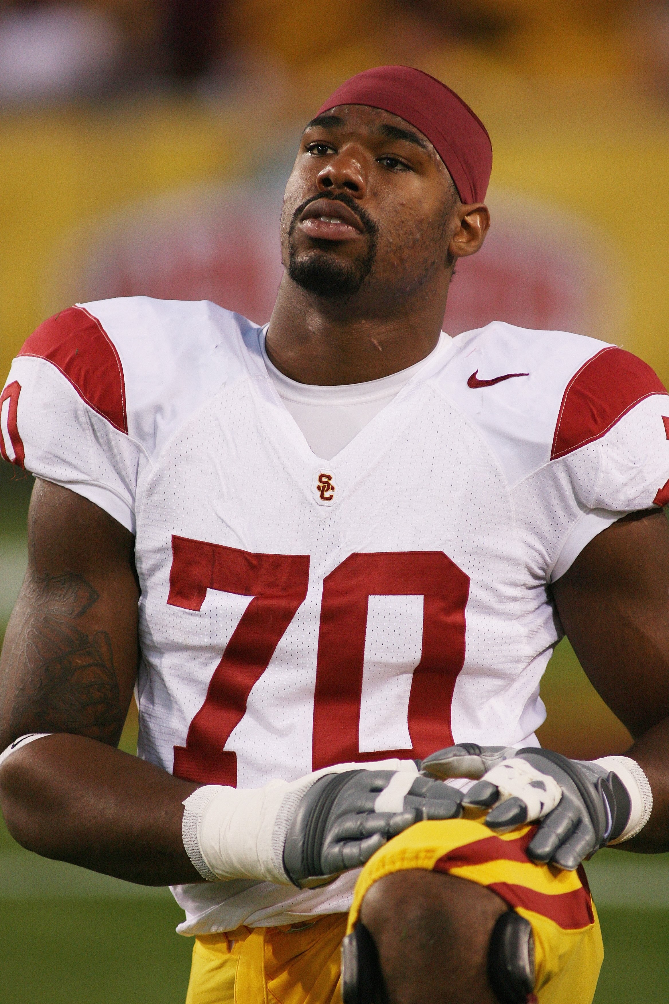 TEMPE, AZ - NOVEMBER 7:  Tyron Smith #70 of the USC Trojans stretches before the game against the Arizona State Sun Devils on November 7, 2009 at Sun Devil Stadium in Tempe, Arizona.  USC won 14-9.  (Photo by Jeff Golden/Getty Images)