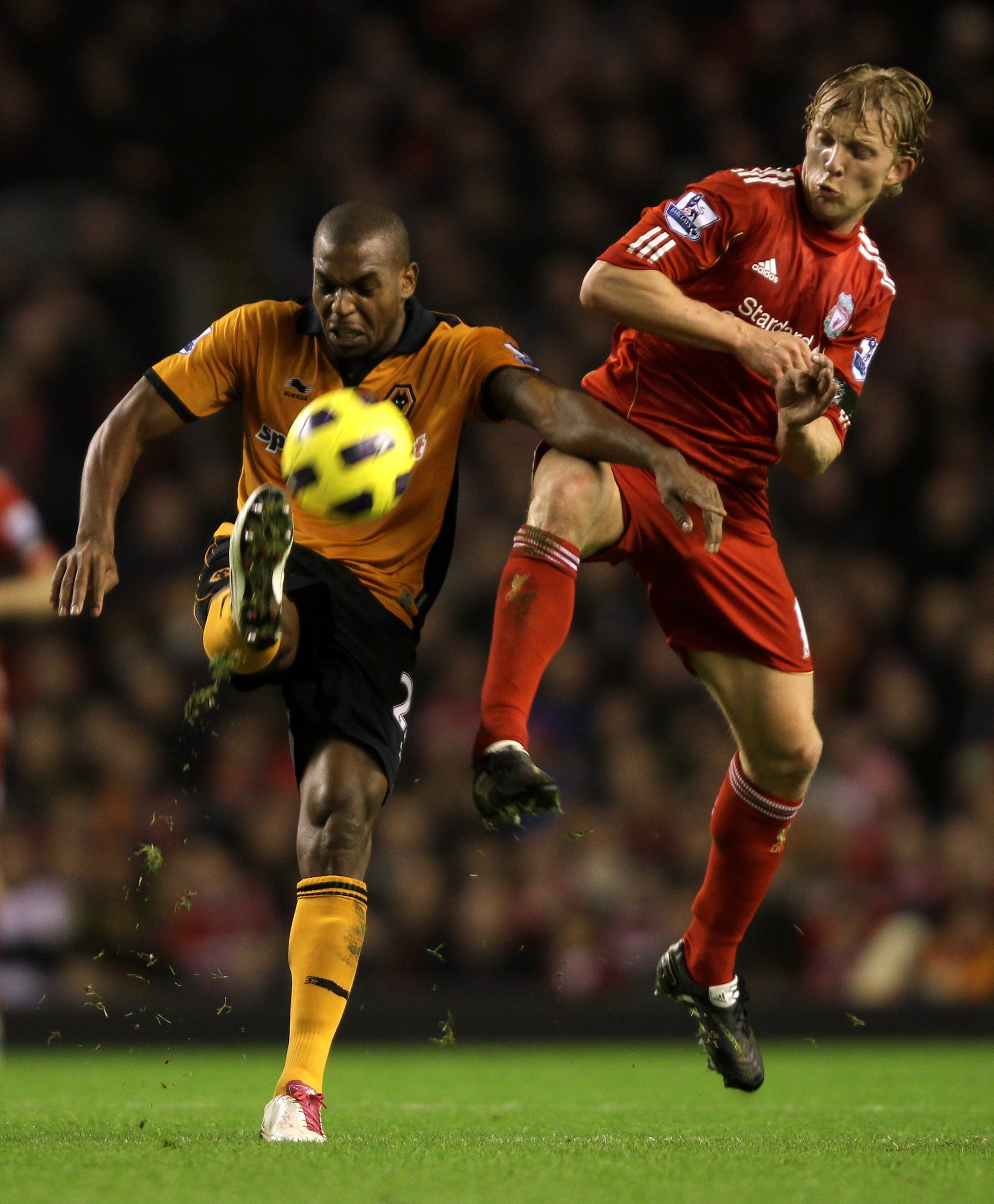 LIVERPOOL, ENGLAND - DECEMBER 29:  Dirk Kuyt of Liverpool competes with Ronald Zubar of Wolverhampton Wanderers during the Barclays Premier League match between Liverpool and Wolverhampton Wanderers at Anfield on December 29, 2010 in Liverpool, England.