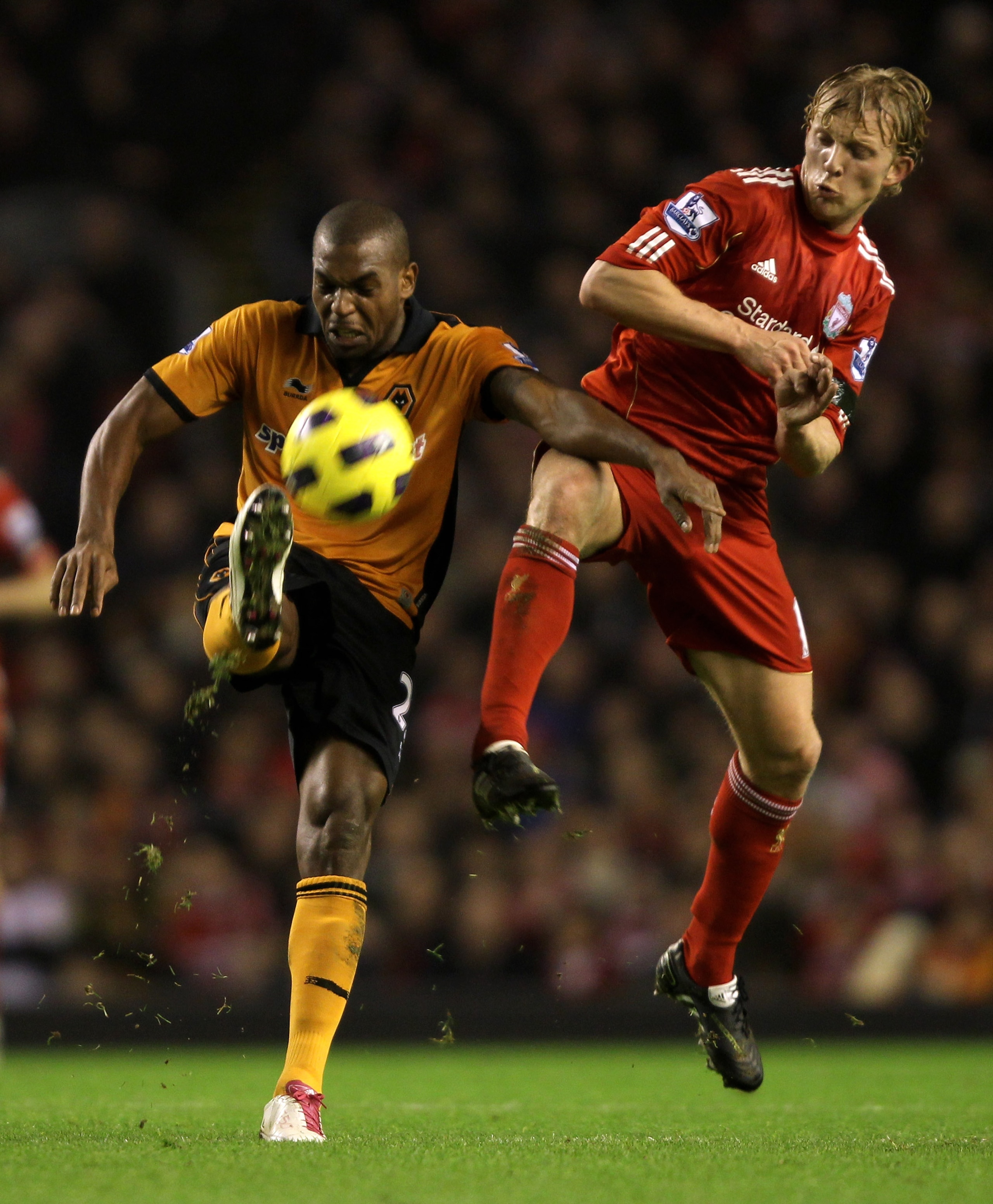 LIVERPOOL, ENGLAND - DECEMBER 29: Dirk Kuyt of Liverpool competes with Ronald Zubar of Wolverhampton Wanderers during the Barclays Premier League match between Liverpool and Wolverhampton Wanderers at Anfield on December 29, 2010 in Liverpool, England. LIVERPOOL, ENGLAND - DECEMBER 29: Dirk Kuyt of Liverpool competes with Ronald Zubar of Wolverhampton Wanderers during the Barclays Premier League match between Liverpool and Wolverhampton Wanderers at Anfield on December 29, 2010 in Liverpool, England.