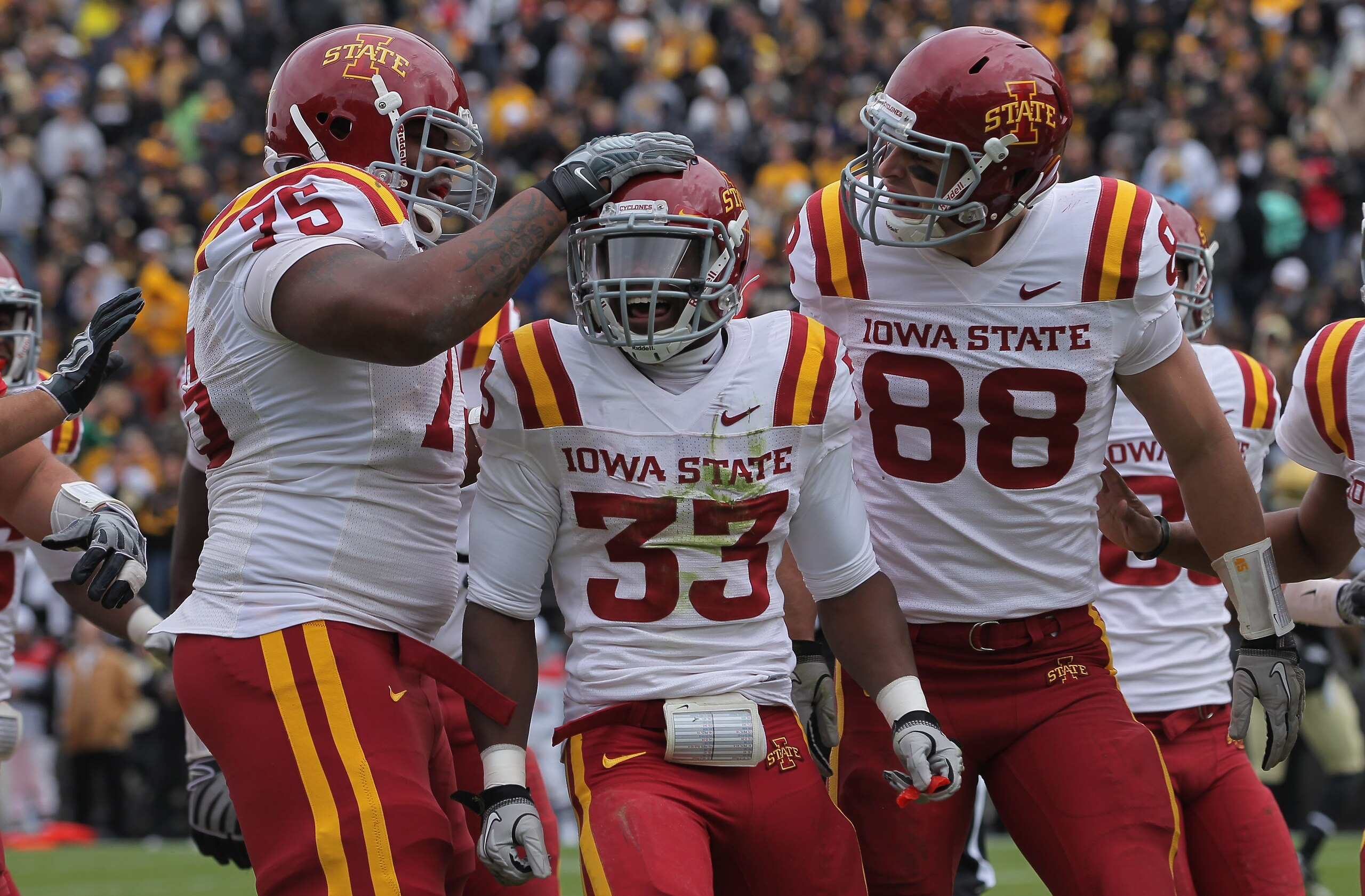 BOULDER, CO - NOVEMBER 13: Alexander Robinson #33 of the Iowa State Cyclones celebrates his eight yard touchdown run in the second quarter with his teammates against the Colorado Buffaloes at Folsom Field on November 13, 2010 in Boulder, Colorado. Colora BOULDER, CO - NOVEMBER 13: Alexander Robinson #33 of the Iowa State Cyclones celebrates his eight yard touchdown run in the second quarter with his teammates against the Colorado Buffaloes at Folsom Field on November 13, 2010 in Boulder, Colorado. Colora