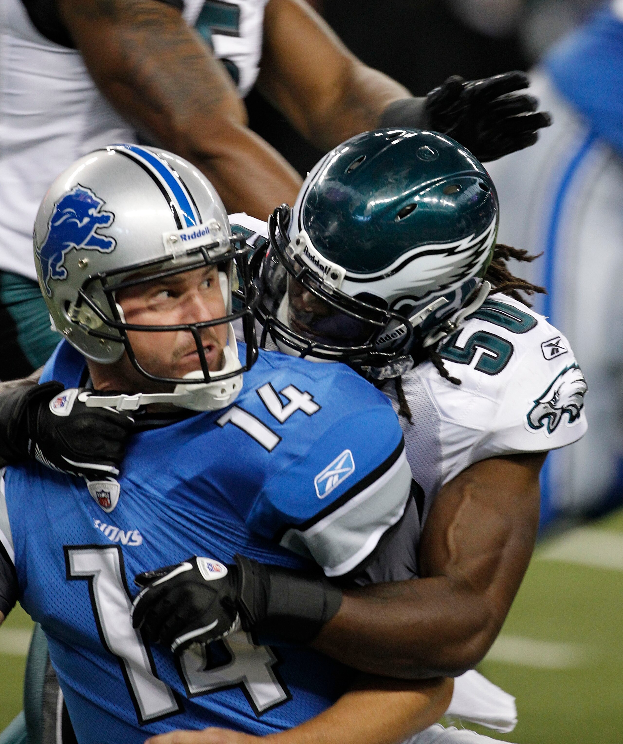 DETROIT - SEPTEMBER 19:  Shaun Hill #14 of the Detroit Lions is sacked by Ernie Sims #50 during the game against the Philadelphia Eagles at Ford Field on September 19, 2010 in Detroit, Michigan. The Eagles defeated the Lions 35-32.  (Photo by Leon Halip/G