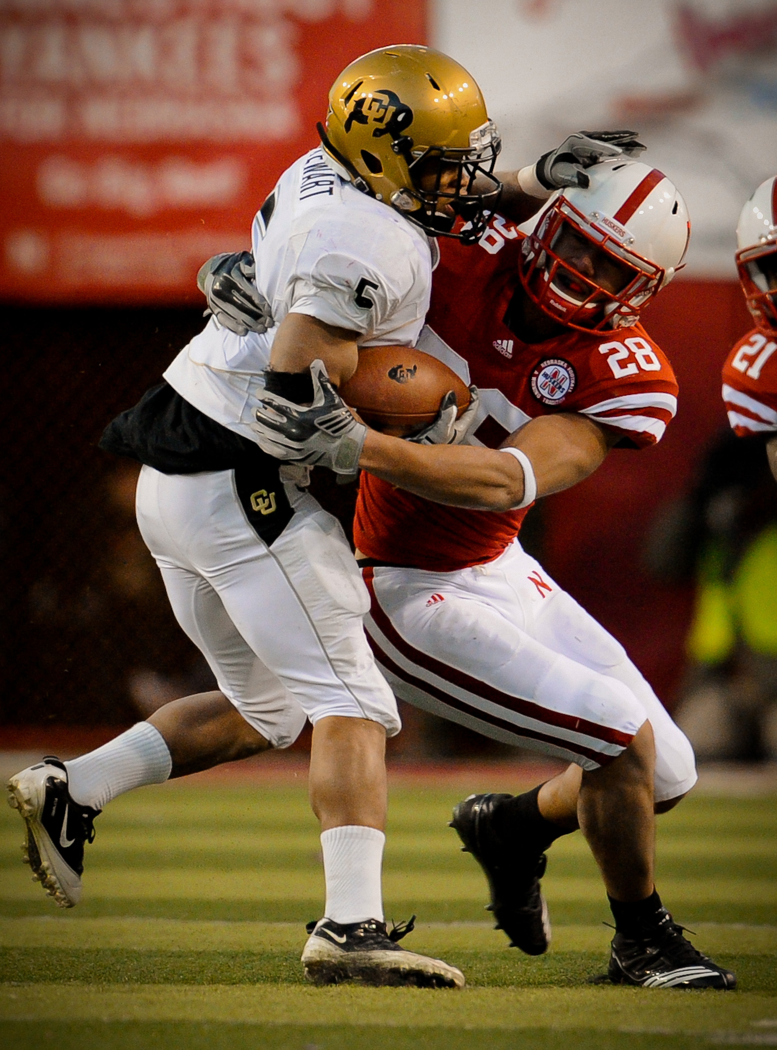 LINCOLN, NE - NOVEMBER 26: Eric Hagg #28 of the Nebraska Cornhuskers brings down Rodney Stewart #5 of the Colorado Buffaloes during the second half of their game at Memorial Stadium on November 26, 2010 in Lincoln, Nebraska. Nebraska defeated Colorado 45- LINCOLN, NE - NOVEMBER 26: Eric Hagg #28 of the Nebraska Cornhuskers brings down Rodney Stewart #5 of the Colorado Buffaloes during the second half of their game at Memorial Stadium on November 26, 2010 in Lincoln, Nebraska. Nebraska defeated Colorado 45-