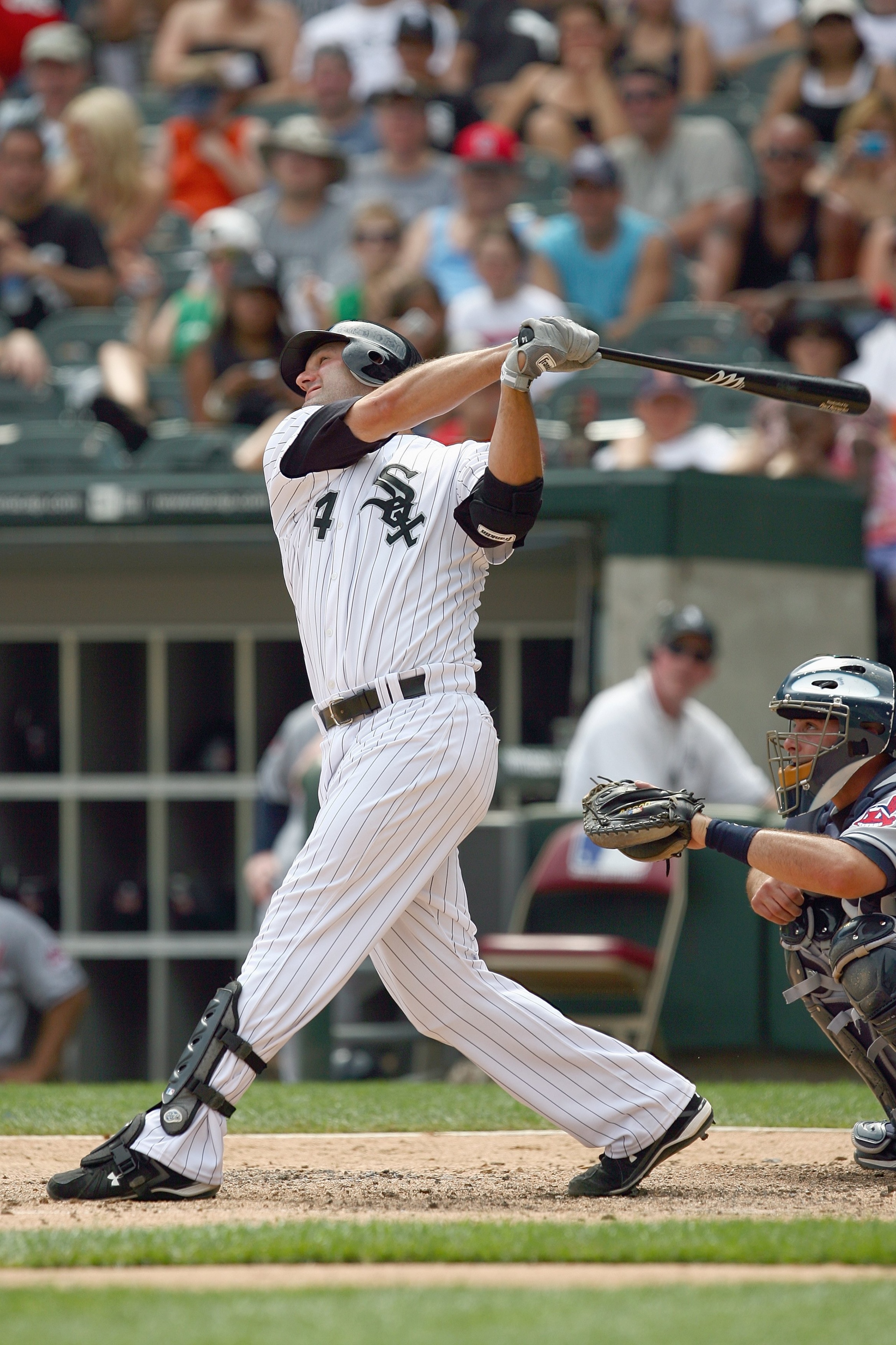 CHICAGO - AUGUST 09:  Paul Konerko #14 of the Chicago White Sox swings at the pitch during the game against the Cleveland Indians on August 9, 2009 at U.S. Cellular Field in Chicago, Illinois. (Photo by Jonathan Daniel/Getty Images)