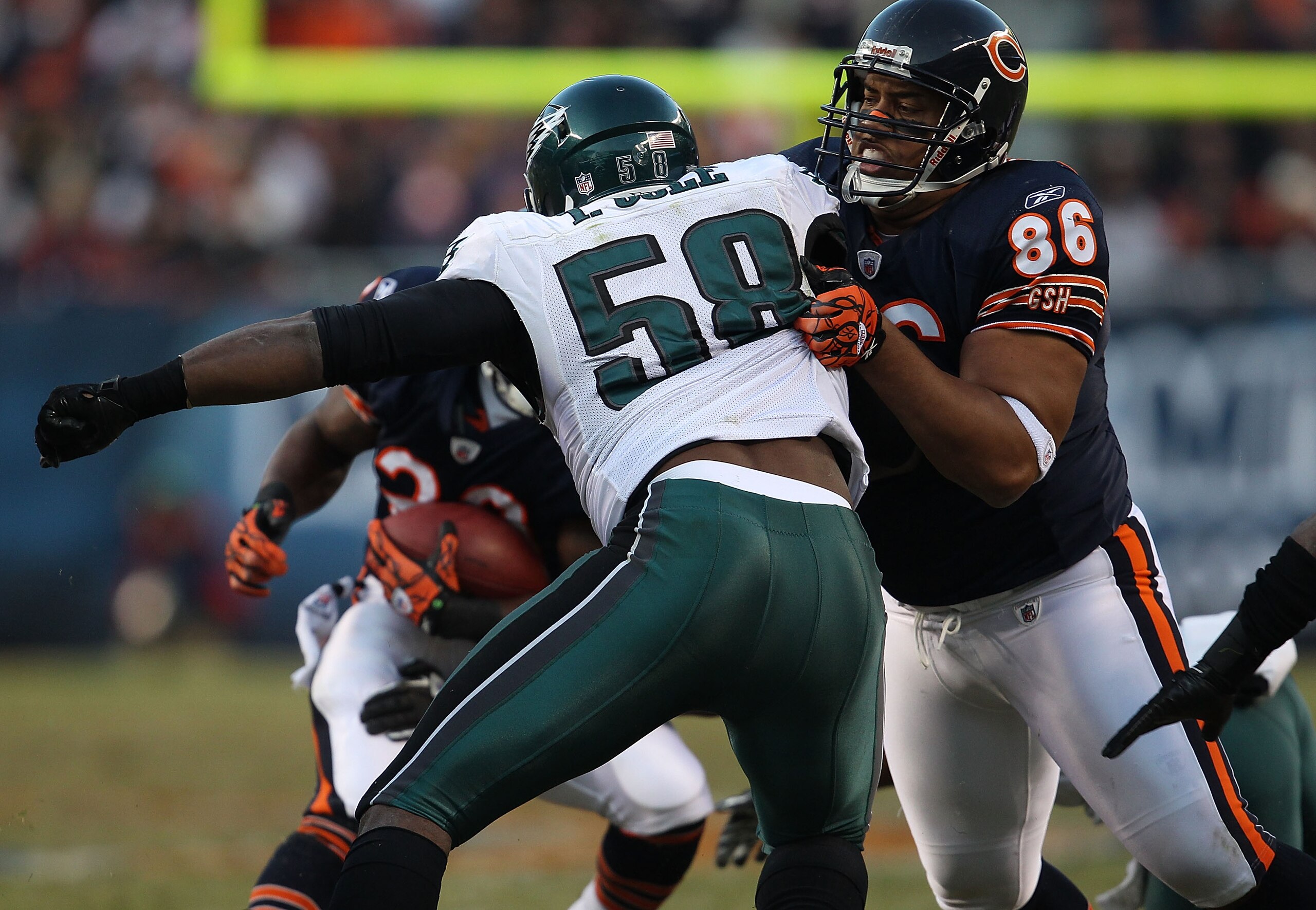 CHICAGO - NOVEMBER 28: Brandon Manumaleuna #86 of the Chicago Bears blocks Trent Cole #58 of the Philadelphia Eagles at Soldier Field on November 28, 2010 in Chicago, Illinois. The Bears defeated the Eagles 31-26. (Photo by Jonathan Daniel/Getty Images)