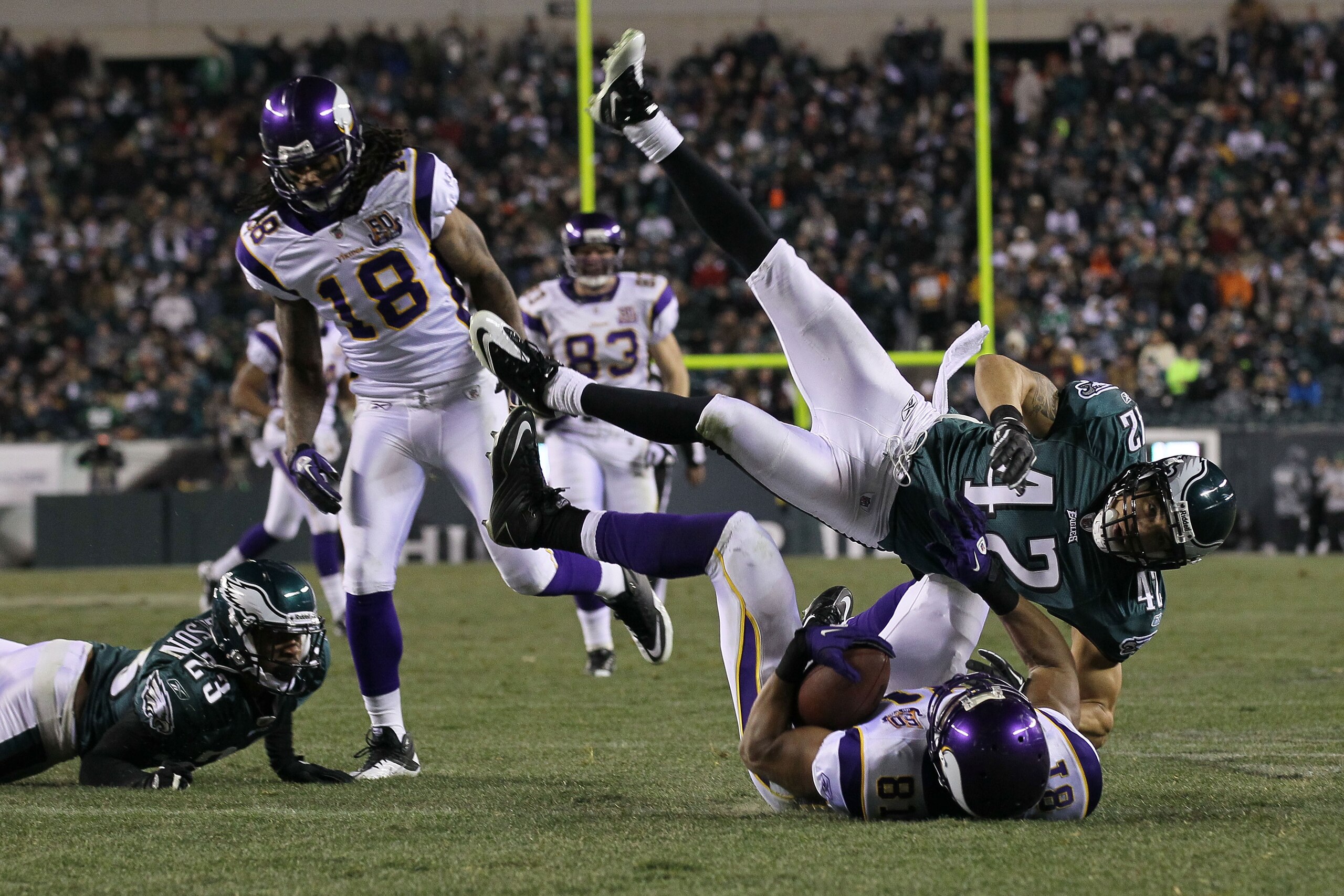 PHILADELPHIA, PA - DECEMBER 28:  Kurt Coleman #42 of the Philadelphia Eagles tackles Visanthe Shiancoe #81 of the Minnesota Vikings at Lincoln Financial Field on December 26, 2010 in Philadelphia, Pennsylvania.  (Photo by Jim McIsaac/Getty Images)