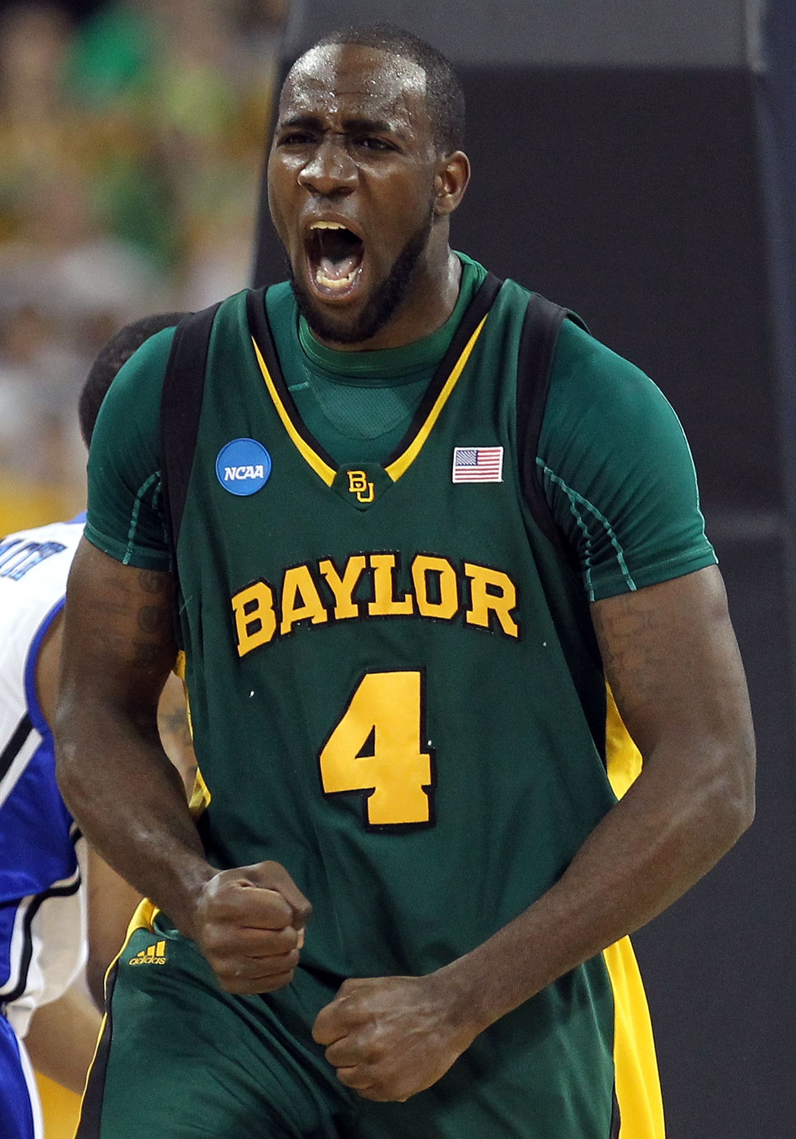 HOUSTON - MARCH 28: Forward Quincy Acy #4 of the Baylor Bears reacts after making a slam dunk against the Duke Blue Devils during the south regional final of the 2010 NCAA men's basketball tournament at Reliant Stadium on March 28, 2010 in Houston, Texas HOUSTON - MARCH 28: Forward Quincy Acy #4 of the Baylor Bears reacts after making a slam dunk against the Duke Blue Devils during the south regional final of the 2010 NCAA men's basketball tournament at Reliant Stadium on March 28, 2010 in Houston, Texas