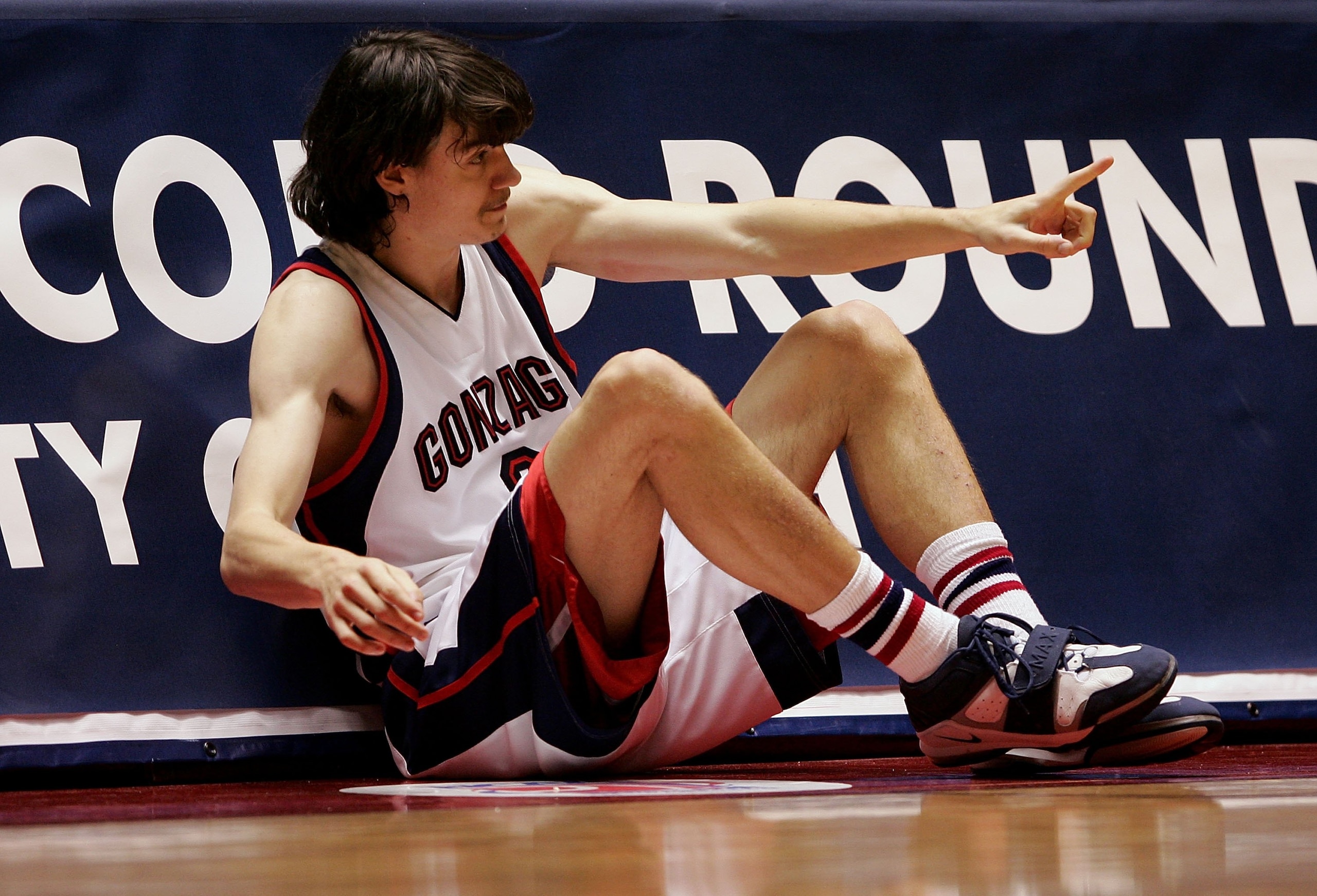 SALT LAKE CITY - MARCH 18:  Adam Morrison #3 of the Gonzaga Bulldogs points to teammates as he sits at the scorers table waiting to reenter the game against the Indiana Hoosiers during the Second Round of the 2006 NCAA Men's Basketball Tournament March 18