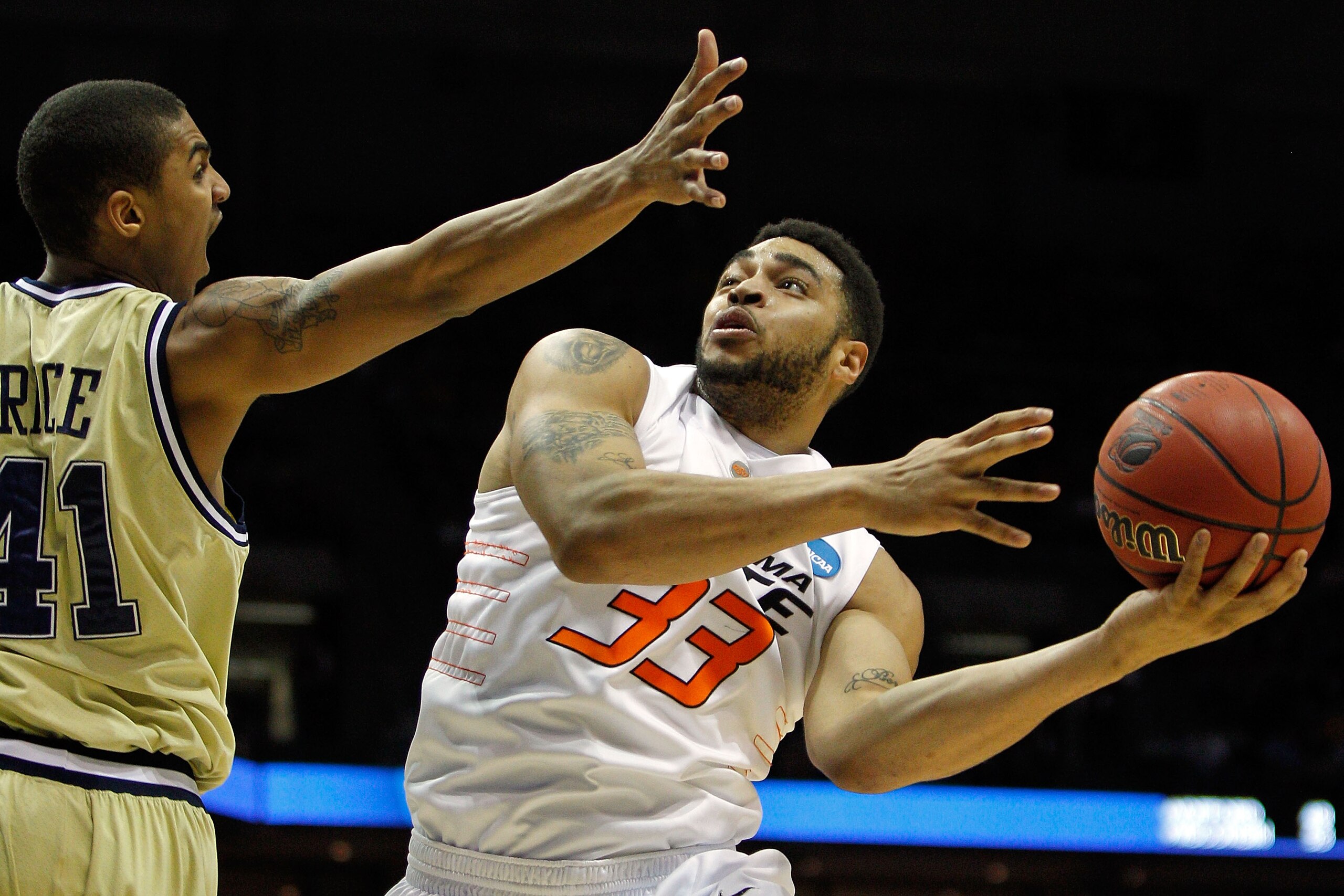 MILWAUKEE - MARCH 19: Marshall Moses #33 of the Oklahoma State Cowboys goes up for a shot against Glen Rice Jr. #41 of the Georgia Tech Yellow Jackets in the first half during the first round of the 2010 NCAA men's basketball tournament at the Bradley Ce MILWAUKEE - MARCH 19: Marshall Moses #33 of the Oklahoma State Cowboys goes up for a shot against Glen Rice Jr. #41 of the Georgia Tech Yellow Jackets in the first half during the first round of the 2010 NCAA men's basketball tournament at the Bradley Ce