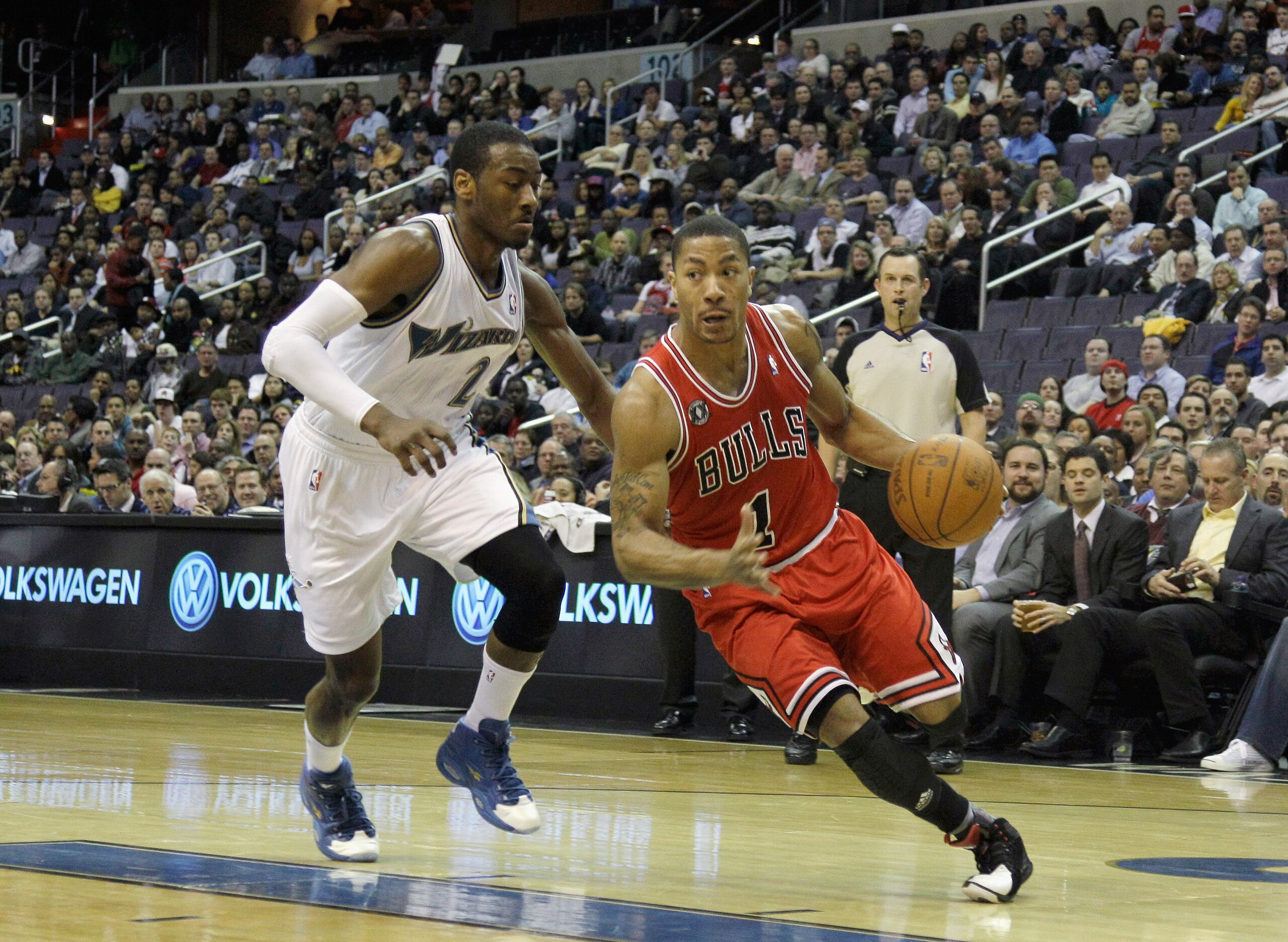 WASHINGTON, DC - FEBRUARY 28: Derrick Rose #1 of the Chicago Bulls drives to the basket while being guarded by John Wall #2 of the Washington Wizardsat the Verizon Center in Washington on February 28, 2011 in Washington, DC. NOTE TO USER: User expressly a