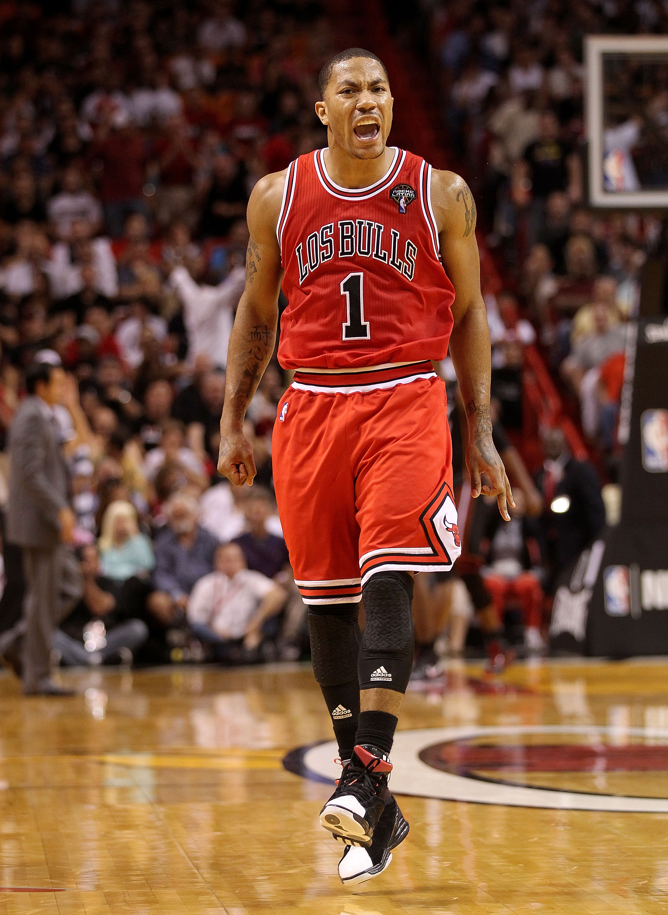 MIAMI, FL - MARCH 06:  Derrick Rose #1 of the Chicago Bulls reacts after making a key 3 pointer during a game against the Miami Heat at American Airlines Arena on March 6, 2011 in Miami, Florida. NOTE TO USER: User expressly acknowledges and agrees that,