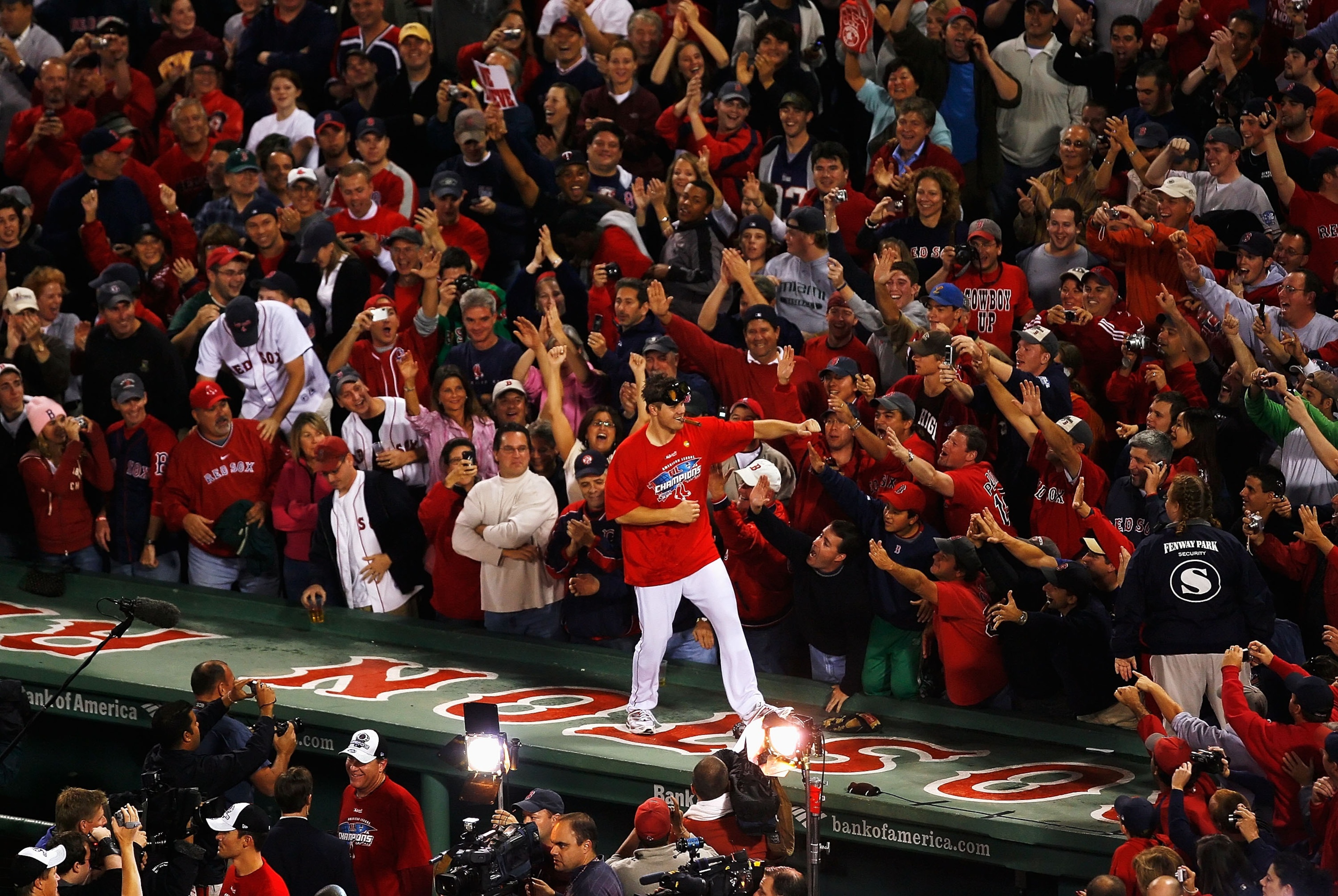 BOSTON - OCTOBER 21:  Jonathan Papelbon #58 of the Boston Red Sox dances on the top of the dugout after defeating the Cleveland Indians by the score of 11-2 to win the American League Championship Series at Fenway Park on October 21, 2007 in Boston, Massa