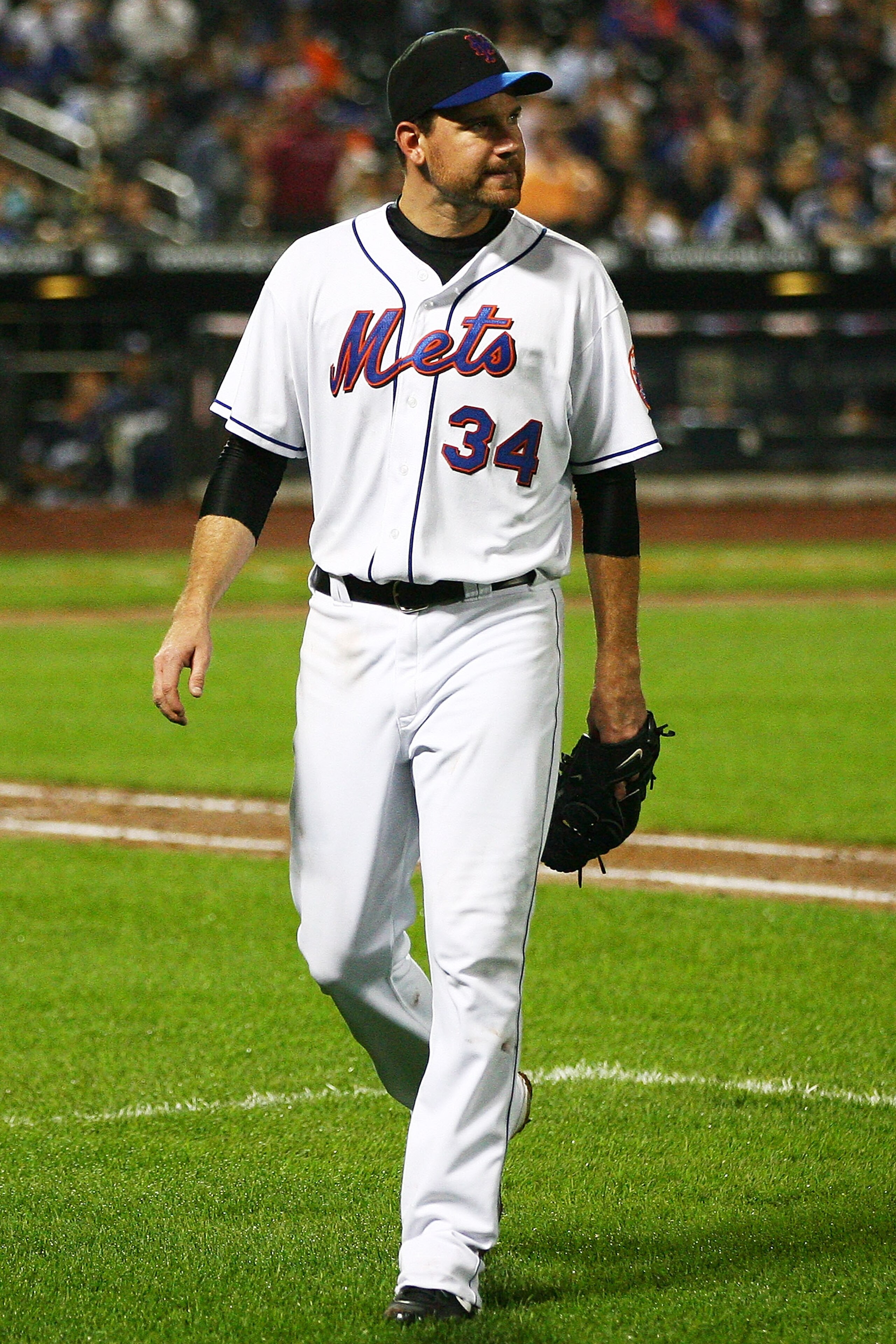 NEW YORK - SEPTEMBER 28:  Mike Pelfrey #34 of the New York Mets walks back to the dugout after pitching for eight innings against the Milwaukee Brewers on September 28, 2010 at Citi Field in the Flushing neighborhood of the Queens borough of New York City
