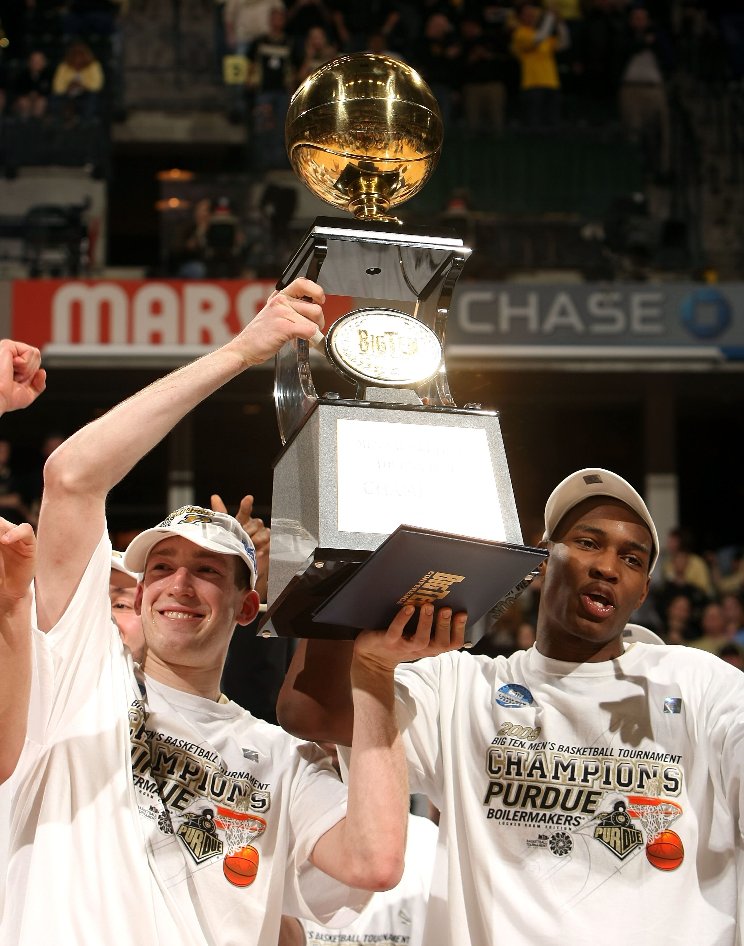 INDIANAPOLIS - MARCH 15:  (L-R) Tournamnet Most Outstanding Player Robbie Hummel #4 and JaJuan Johnson #25 of the Purdue Boilermakers celebrate with the Big Ten tournamnet championship trophy after their 65-61 win against the Ohio State Buckeyes during th