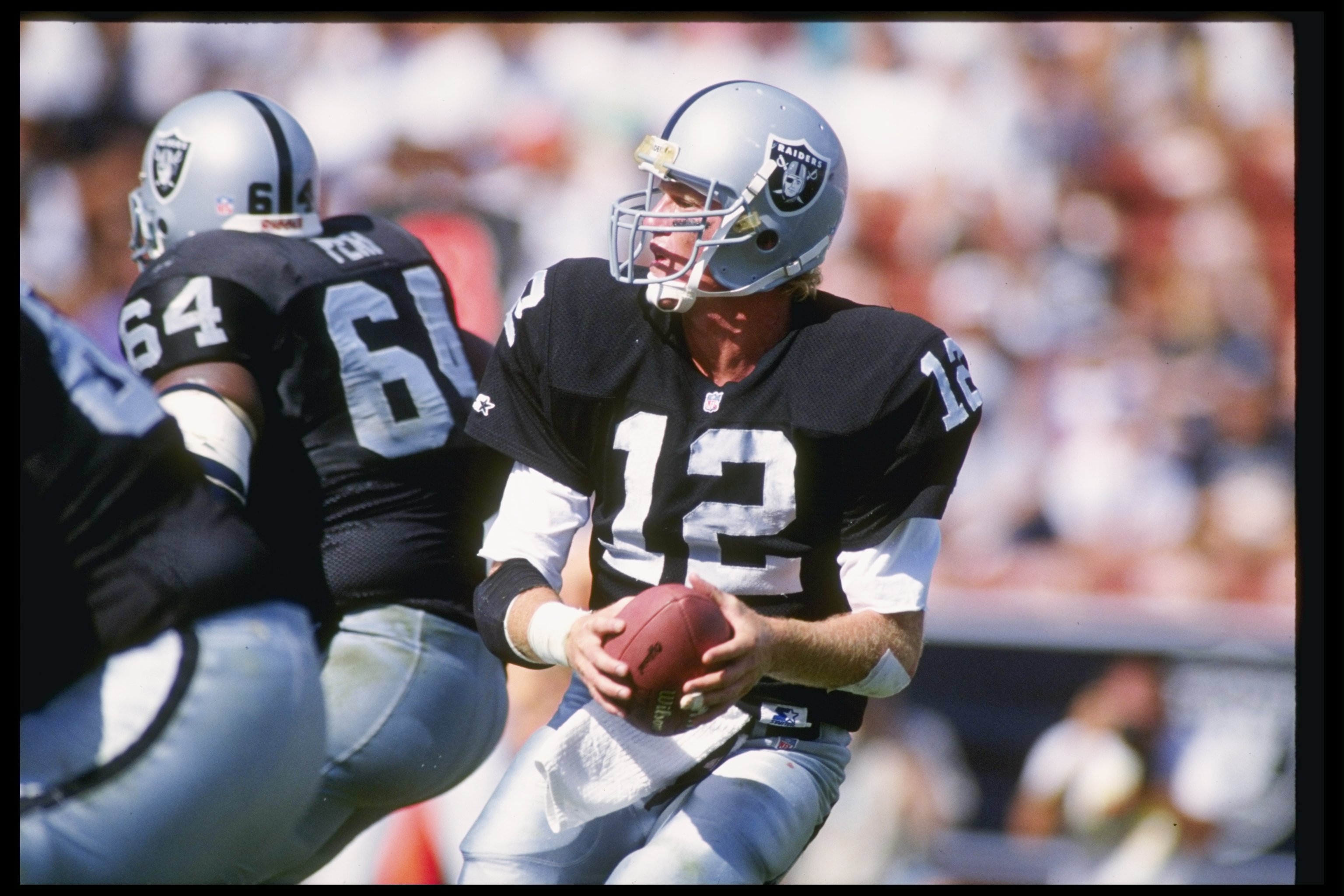 4 Oct 1992:  Quarterback Todd Marinovich of the Los Angeles Raiders looks to pass the ball during a game against the New York Giants at the Los Angeles Memorial Stadium in os Angeles, California.  The Cowboys won the game, 13-10Mandatory Credit: Ken Levin