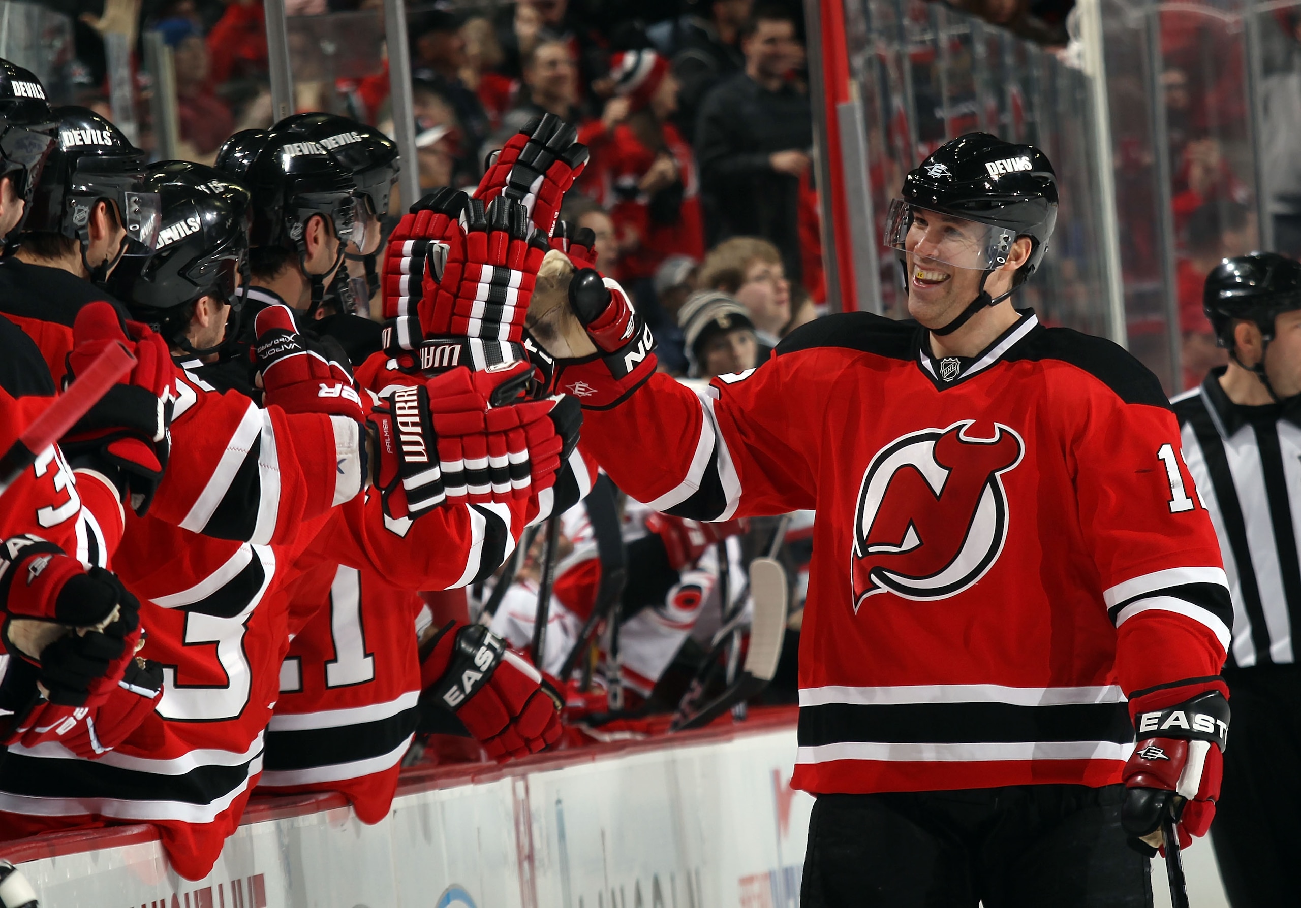 NEWARK, NJ - FEBRUARY 16: Brian Rolston #12 of the New Jersey Devils celebrates his goal at 34 seconds of the third period against the Carolina Hurricanes at the Prudential Center on February 16, 2011 in Newark, New Jersey. The Devils defeated the Hurrica NEWARK, NJ - FEBRUARY 16: Brian Rolston #12 of the New Jersey Devils celebrates his goal at 34 seconds of the third period against the Carolina Hurricanes at the Prudential Center on February 16, 2011 in Newark, New Jersey. The Devils defeated the Hurrica