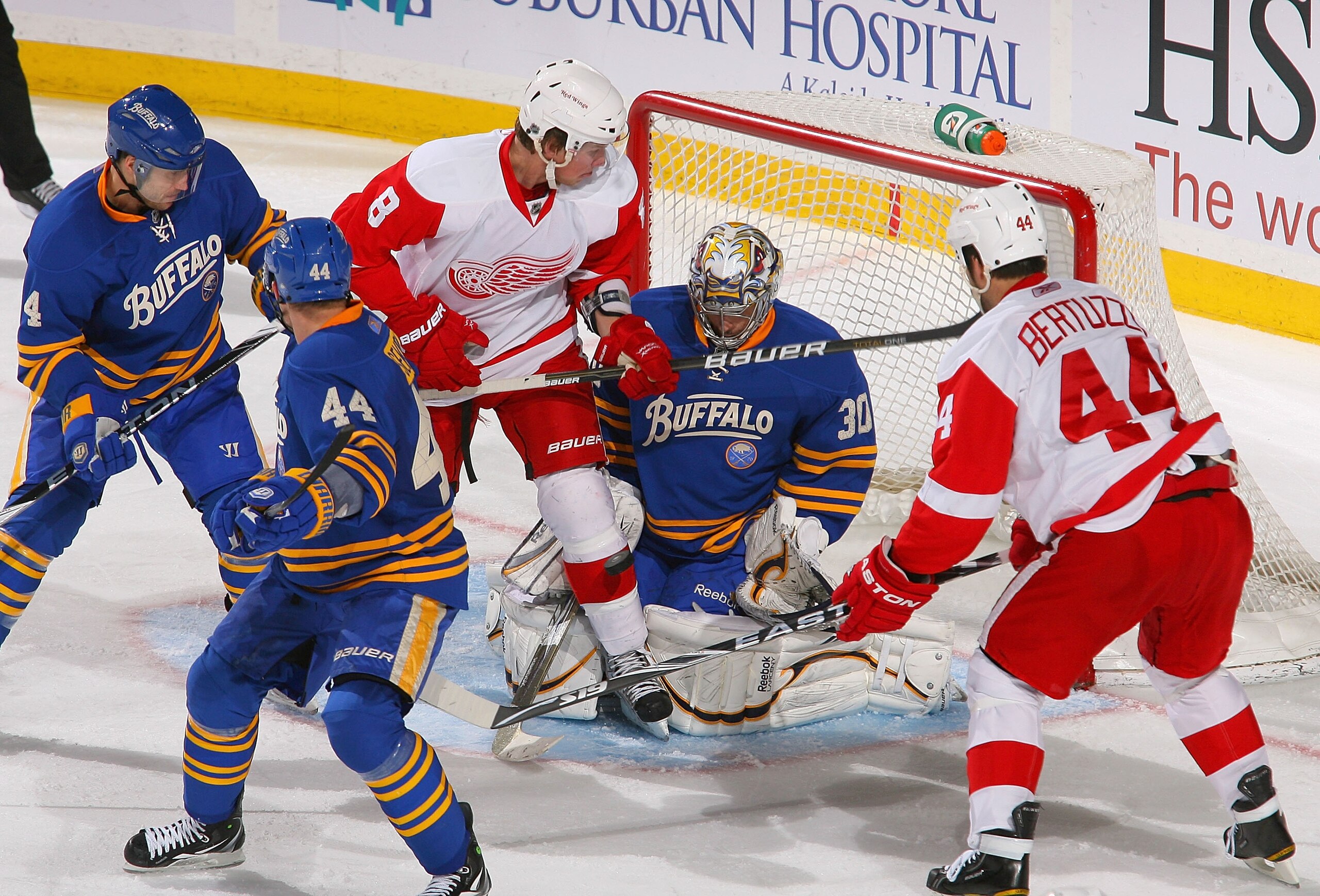 BUFFALO, NY - FEBRUARY 26: Ryan Miller #30 of the Buffalo Sabres makes a save between Justin Abdelkader #8 and Todd Bertuzzi #44 of the Detroit Red Wings at HSBC Arena on February 26, 2011 in Buffalo, New York. (Photo by Rick Stewart/Getty Images) BUFFALO, NY - FEBRUARY 26: Ryan Miller #30 of the Buffalo Sabres makes a save between Justin Abdelkader #8 and Todd Bertuzzi #44 of the Detroit Red Wings at HSBC Arena on February 26, 2011 in Buffalo, New York. (Photo by Rick Stewart/Getty Images)