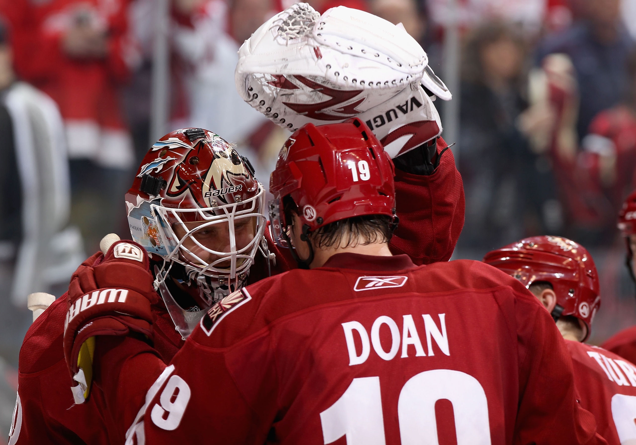 GLENDALE, AZ - MARCH 05: Shane Doan #19 of the Phoenix Coyotes celebrates with goaltender Ilya Bryzgalov #30 after defeating the Detroit Red Wings in the NHL game at Jobing.com Arena on March 5, 2011 in Glendale, Arizona. The Coyotes defeated the Red Wi GLENDALE, AZ - MARCH 05: Shane Doan #19 of the Phoenix Coyotes celebrates with goaltender Ilya Bryzgalov #30 after defeating the Detroit Red Wings in the NHL game at Jobing.com Arena on March 5, 2011 in Glendale, Arizona. The Coyotes defeated the Red Wi