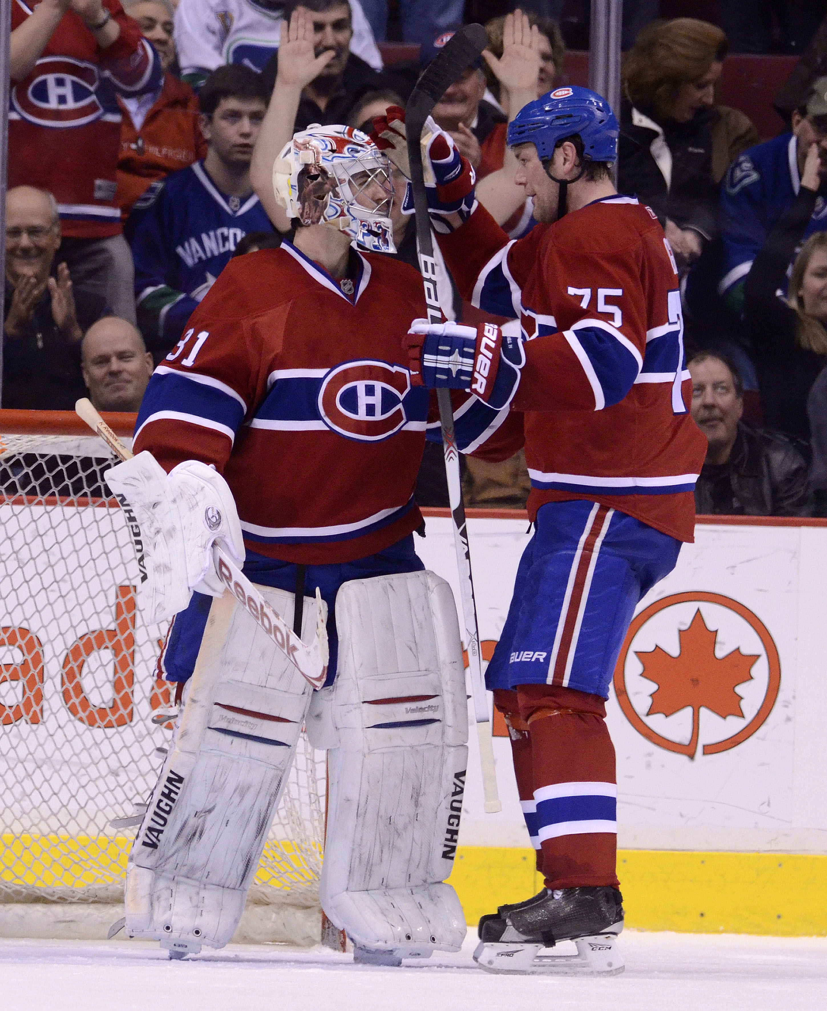 VANCOUVER, CANADA - FEBRUARY 22: Goalie Carey Price #31 of the Montreal Canadiens is congratulated by Hal Gill #75 after defeating the Vancouver Canucks in NHL action on February 22, 2011 at Rogers Arena in Vancouver, British Columbia, Canada.  (Photo by