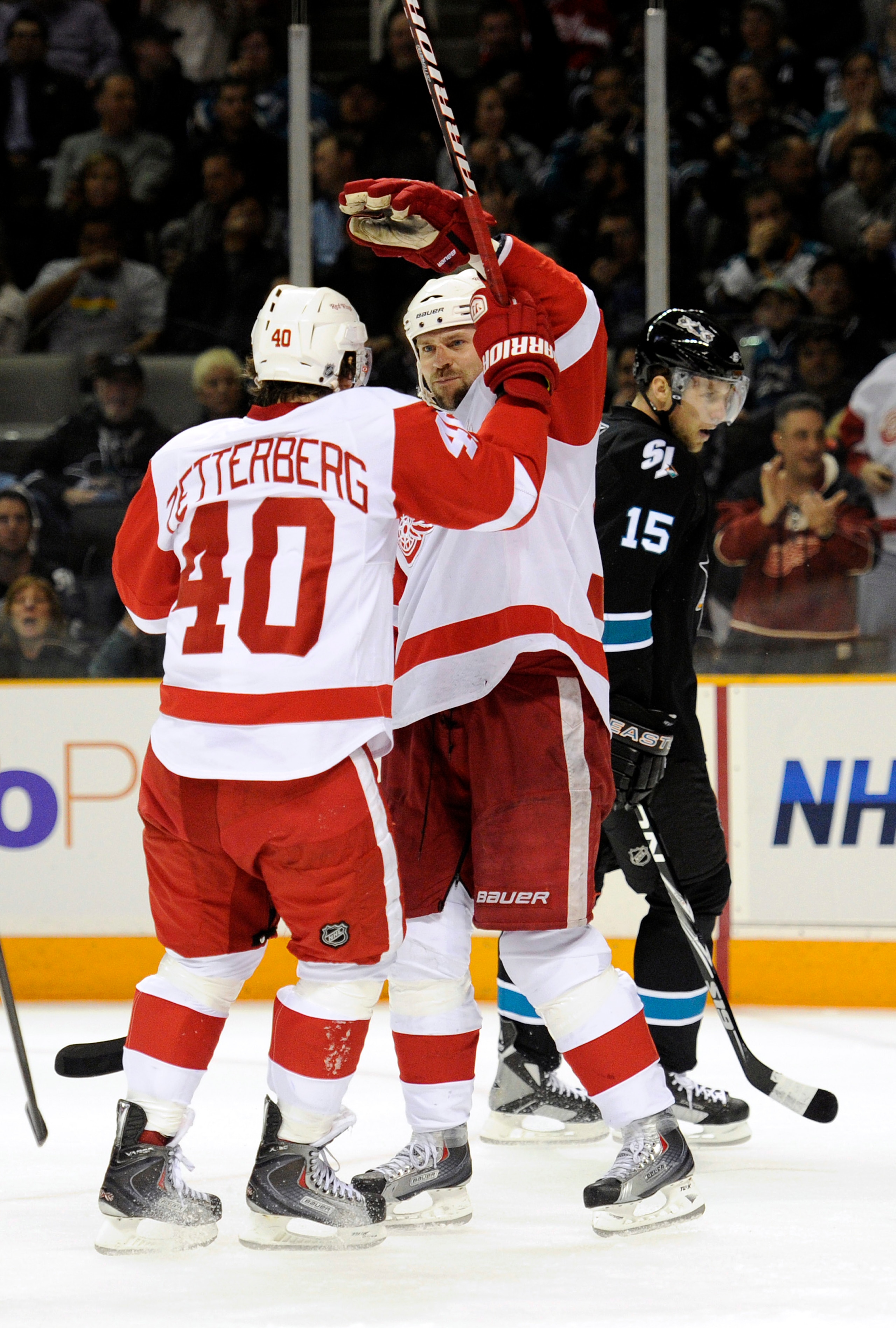 SAN JOSE, CA - MARCH 3: Tomas Holmstrom #96 of the Detroit Red Wings scores a goal and celebrates with teammate Henrik Zetterberg #40 against the San Jose Sharks in the first period of an NHL hockey game at the HP Pavilion on March 3, 2011 in San Jose, Ca SAN JOSE, CA - MARCH 3: Tomas Holmstrom #96 of the Detroit Red Wings scores a goal and celebrates with teammate Henrik Zetterberg #40 against the San Jose Sharks in the first period of an NHL hockey game at the HP Pavilion on March 3, 2011 in San Jose, Ca