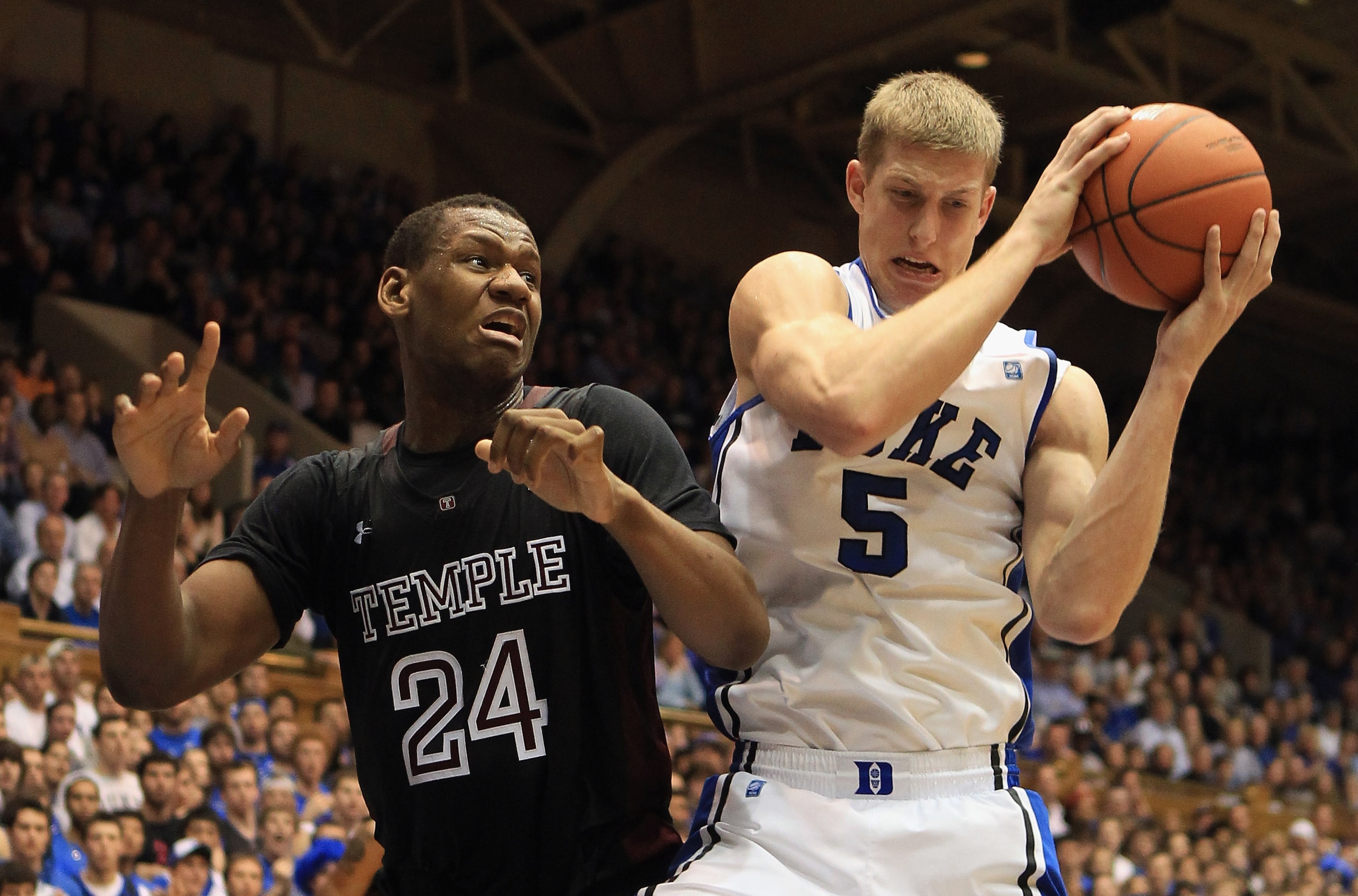 DURHAM, NC - FEBRUARY 23: Lavoy Allen #24 of the Temple Owls battles for a loose ball with Mason Plumlee #5 of the Duke Blue Devils during their game at Cameron Indoor Stadium on February 23, 2011 in Durham, North Carolina.  (Photo by Streeter Lecka/Getty