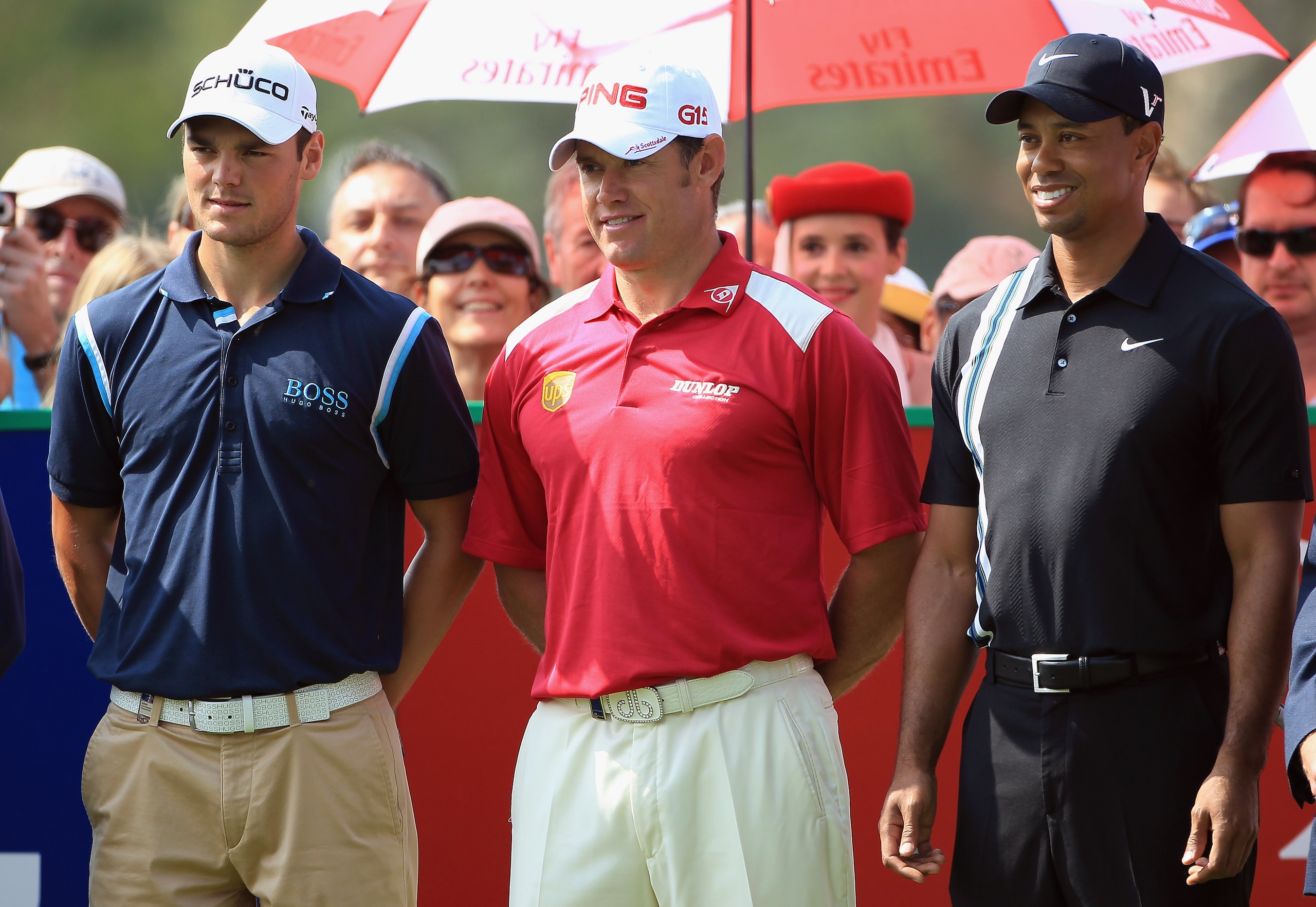 DUBAI, UNITED ARAB EMIRATES - FEBRUARY 10:  Lee Westwood of England the world's number 1, is flanked by Martin Kaymer of Germany (left) the world's number 2, and Tiger Woods of the USA (right) the world's number 3, on the 1st tee during the first round of