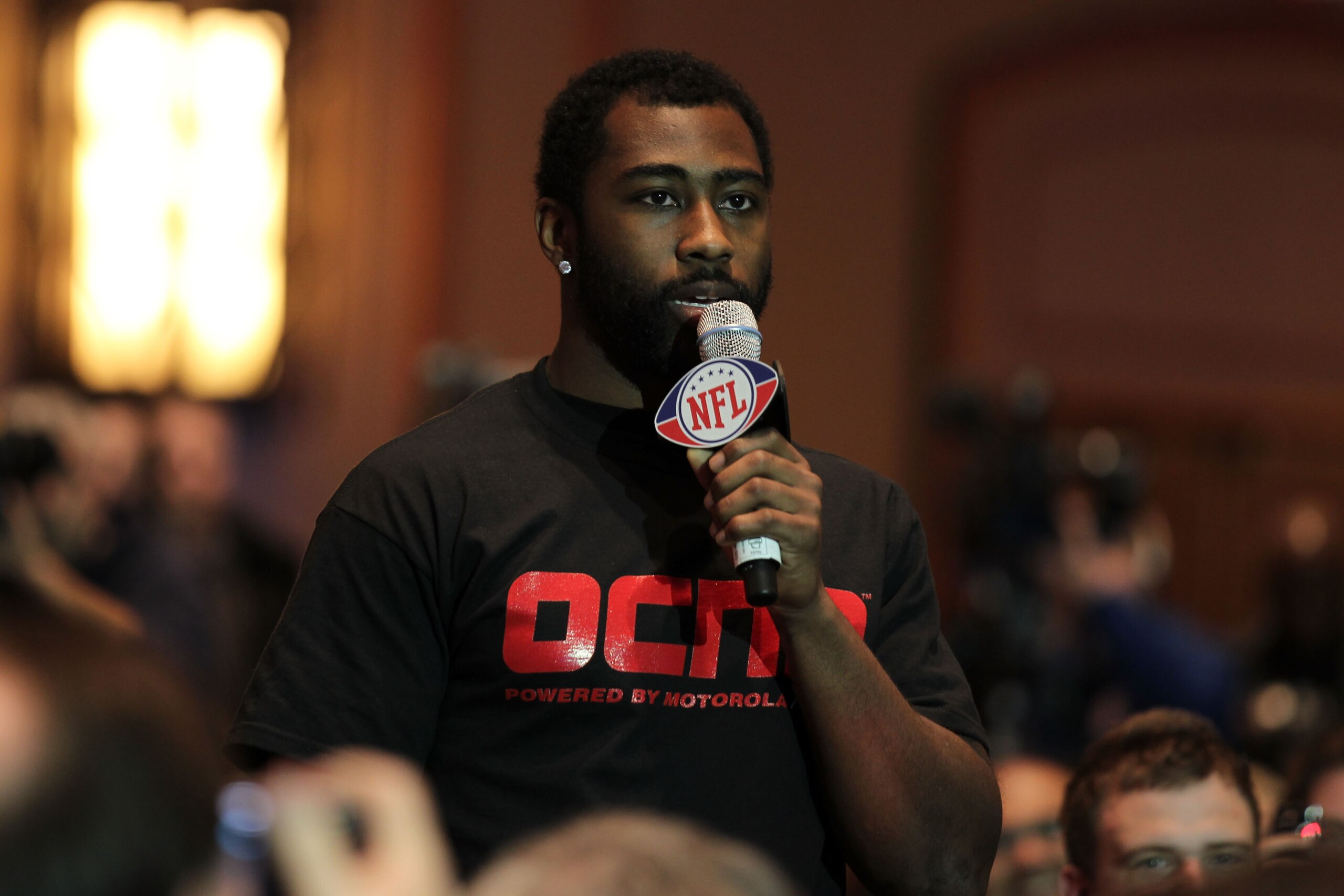DALLAS, TX - FEBRUARY 03:  NFL player Darrelle Revis of the New York Jets asks will.i.am of the Black Eyed Peas a question at the Bridgestone Super Bowl XLV Halftime Show press conference on February 3, 2011 in Dallas, Texas.  (Photo by Christopher Polk/G