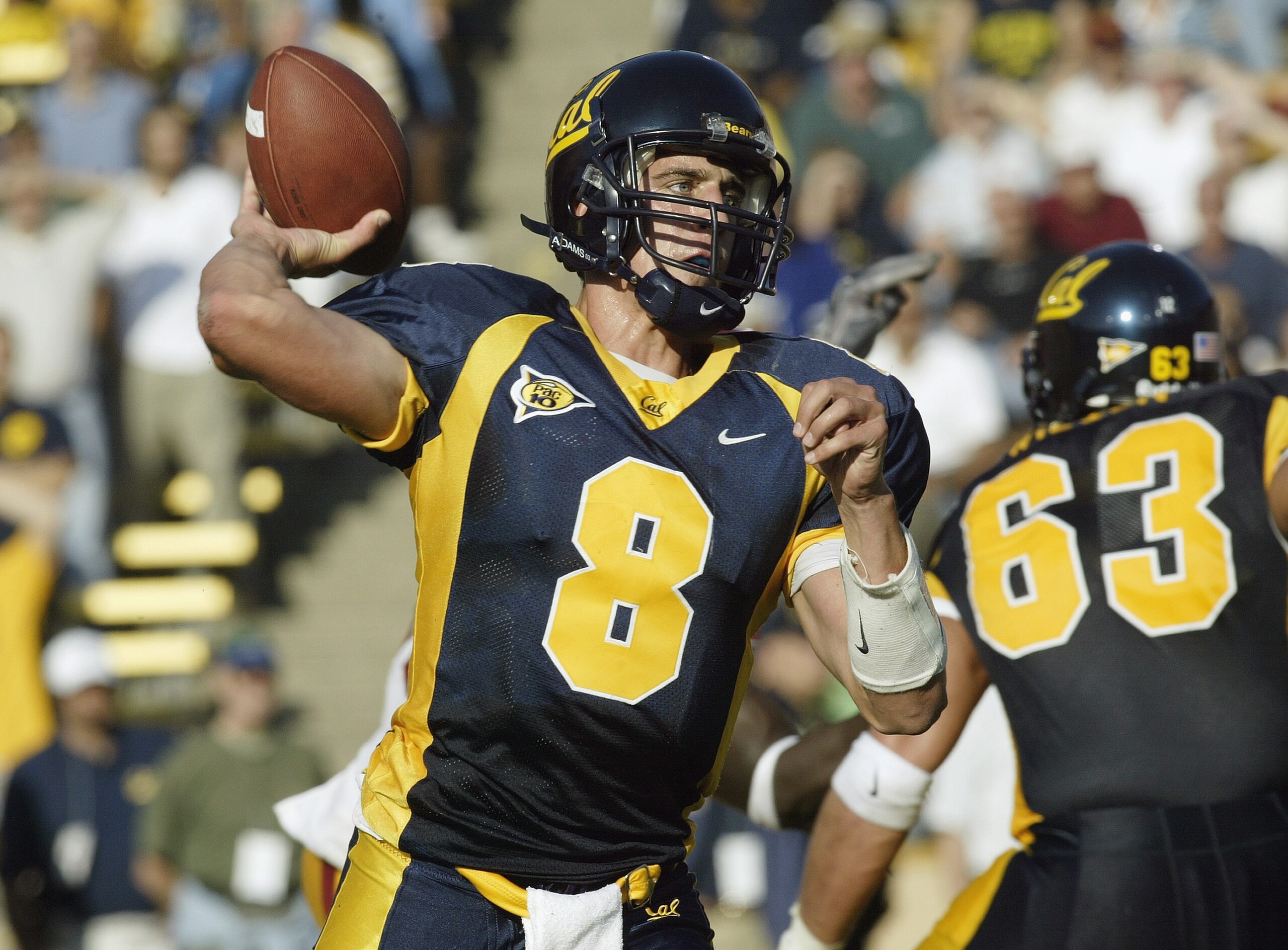 BERKELEY, CA  - SEPTEMBER 27:  Quarterback Aaron Rodgers #8 of the California Golden Bears makes the pass during the game against the USC Trojans at Memorial Stadium on September 27, 2003 in Berkeley, California.  Cal won 34-31 in triple overtime.  (Photo