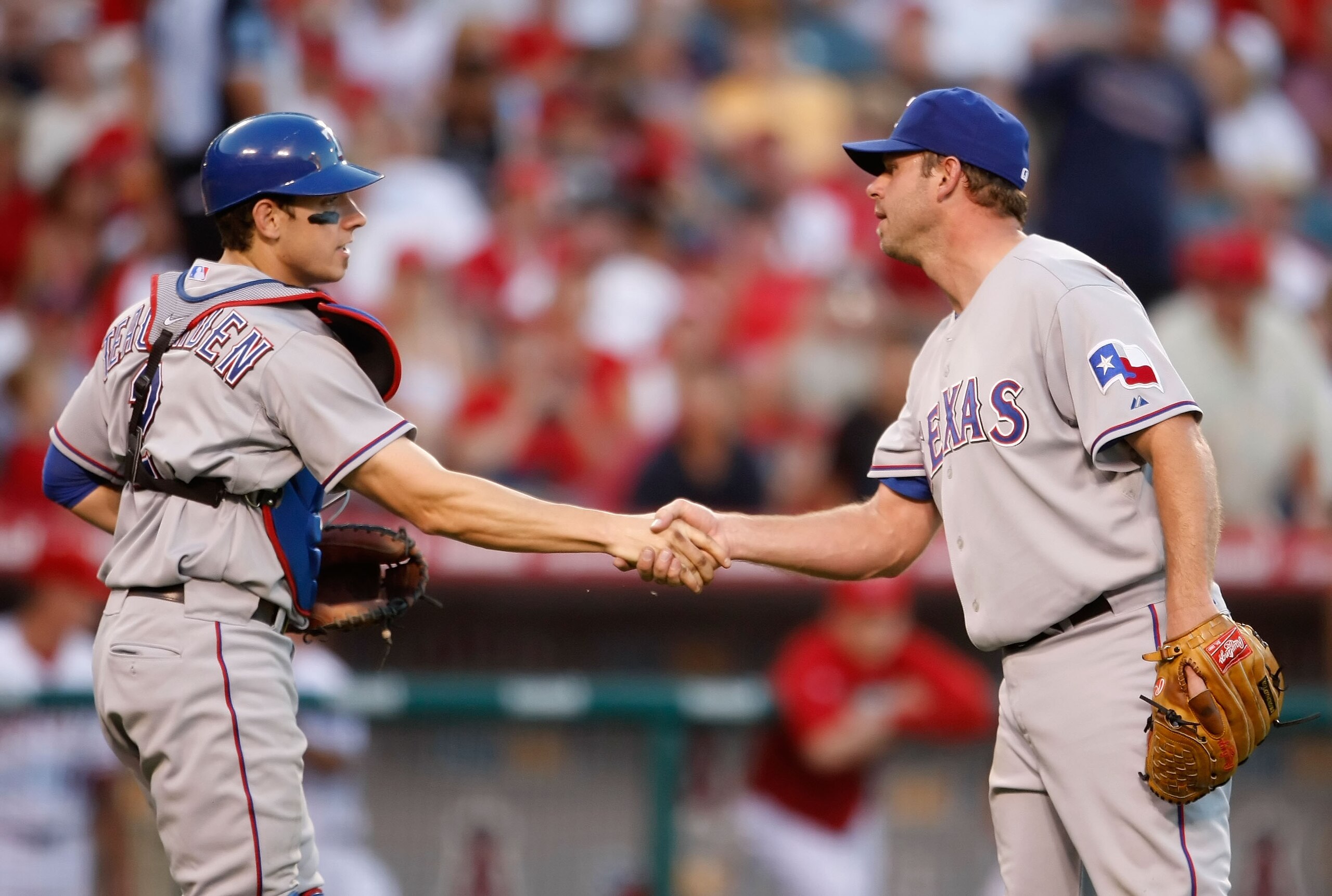 ANAHEIM, CA - OCTOBER 01:  Taylor Teagarden (L) #2 and Kevin Millwood #33 of the Texas Rangers congratulate one another following their victory over the Los Angeles Angels of Anaheim at Angel Stadium on October 1, 2009 in Anaheim, California. The Rangers