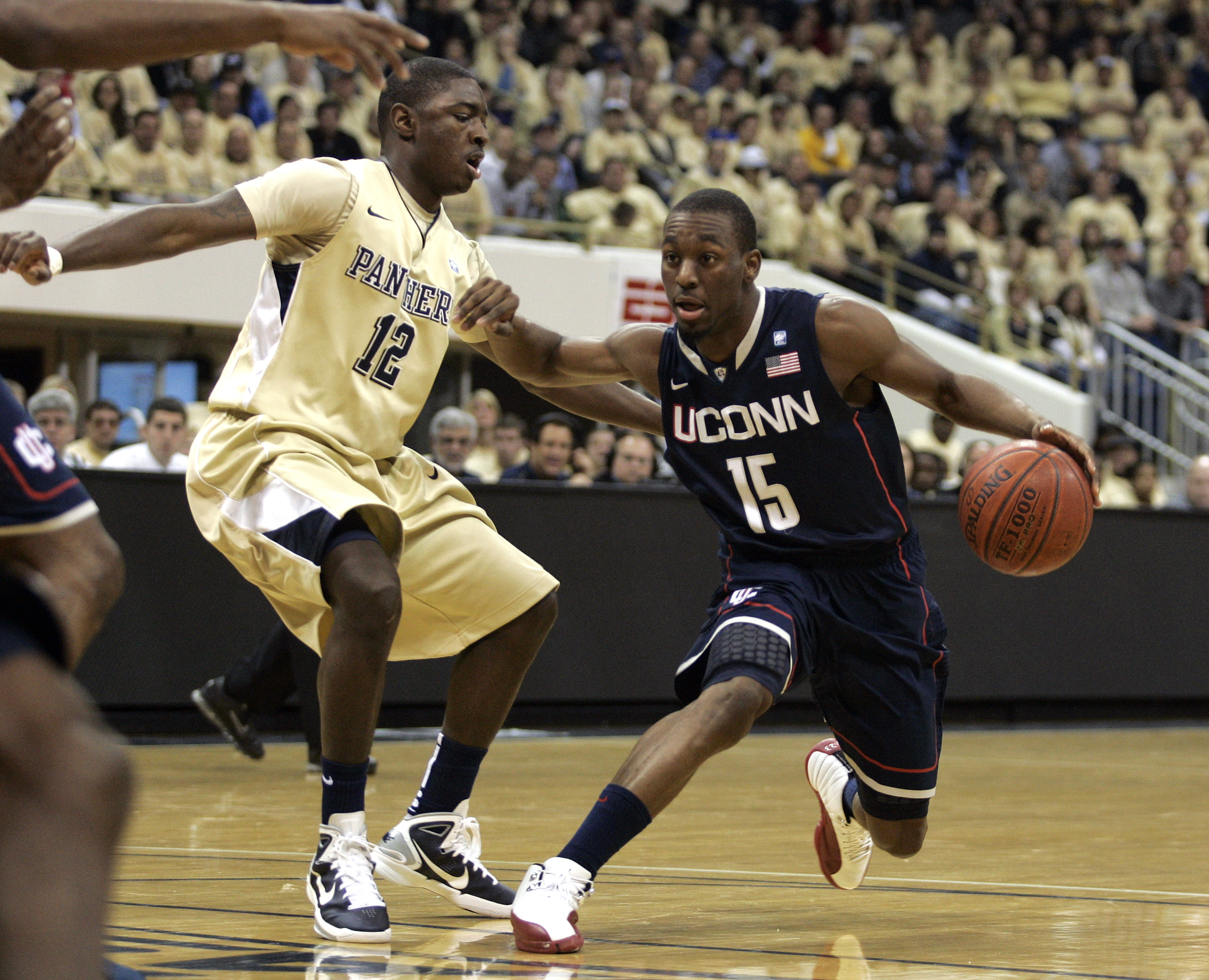 PITTSBURGH, PA - DECEMBER 27: Kemba Walker #15 of the Connecticut Huskies drives to the basket against Ashton Gibbs #12 of the Pittsburgh Panthers at Petersen Events Center on December 27, 2010 in Pittsburgh, Pennsylvania. (Photo by Justin K. Aller/Gett