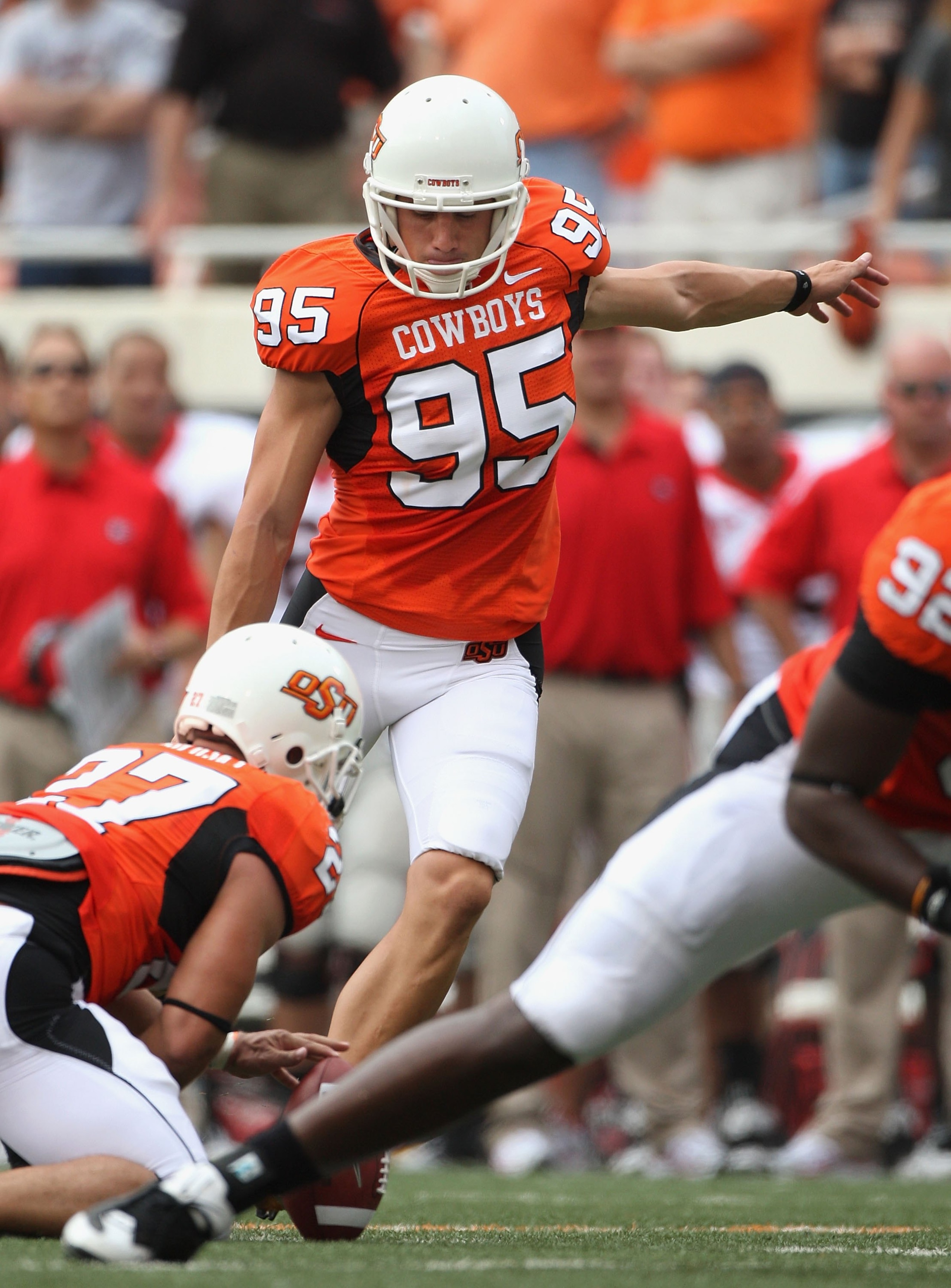 STILLWATER, OK - SEPTEMBER 05:  Kicker Dan Bailey #95 of the Oklahoma State Cowboys kicks a field goal during the college football game against the Georgia Bulldogs at Boone Pickens Stadium on September 5, 2009 in Stillwater, Oklahoma.  The Cowboys defeat
