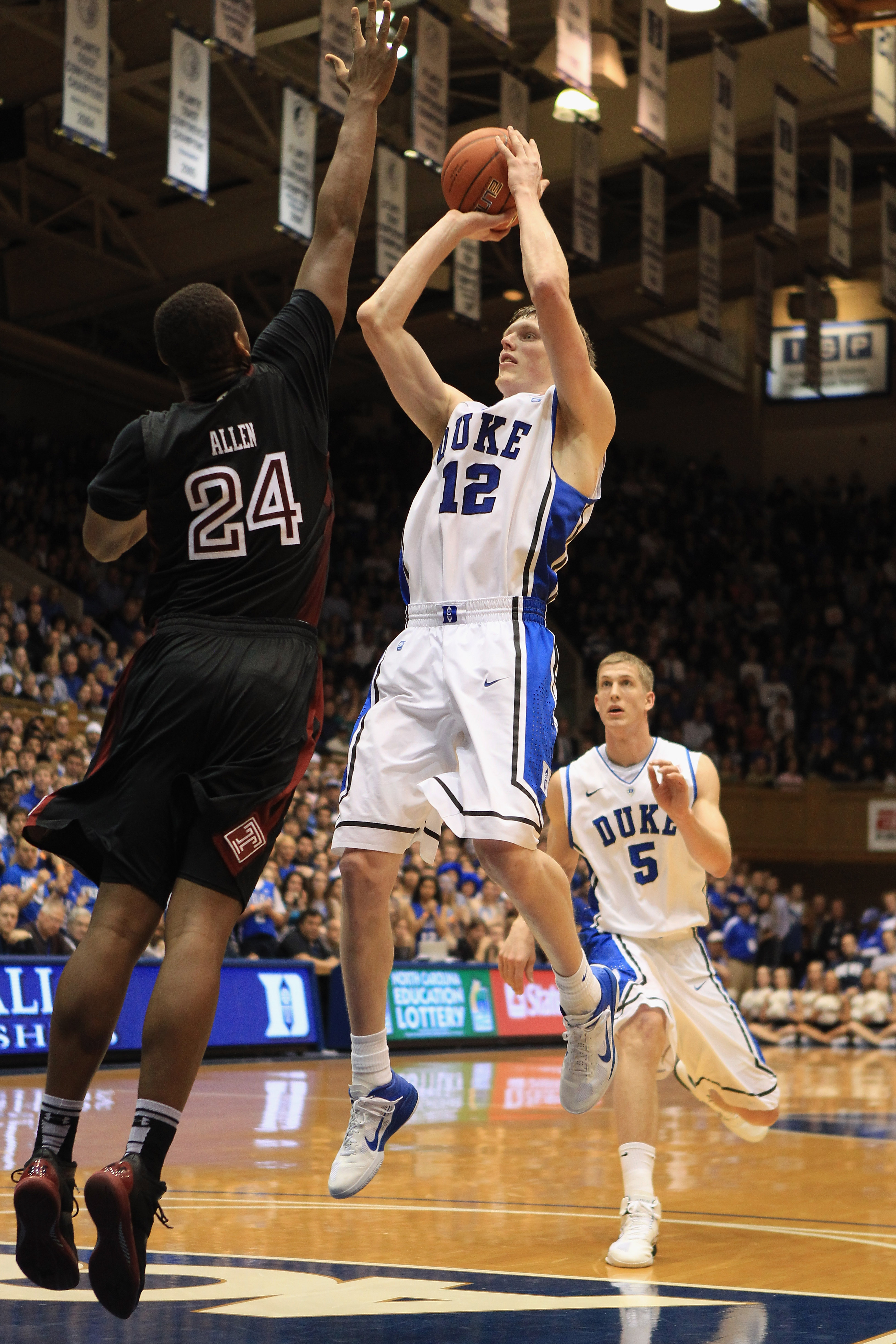 DURHAM, NC - FEBRUARY 23: Lavoy Allen #24 of the Temple Owls tries to stop Kyle Singler #12 of the Duke Blue Devils during their game at Cameron Indoor Stadium on February 23, 2011 in Durham, North Carolina. (Photo by Streeter Lecka/Getty Images)
