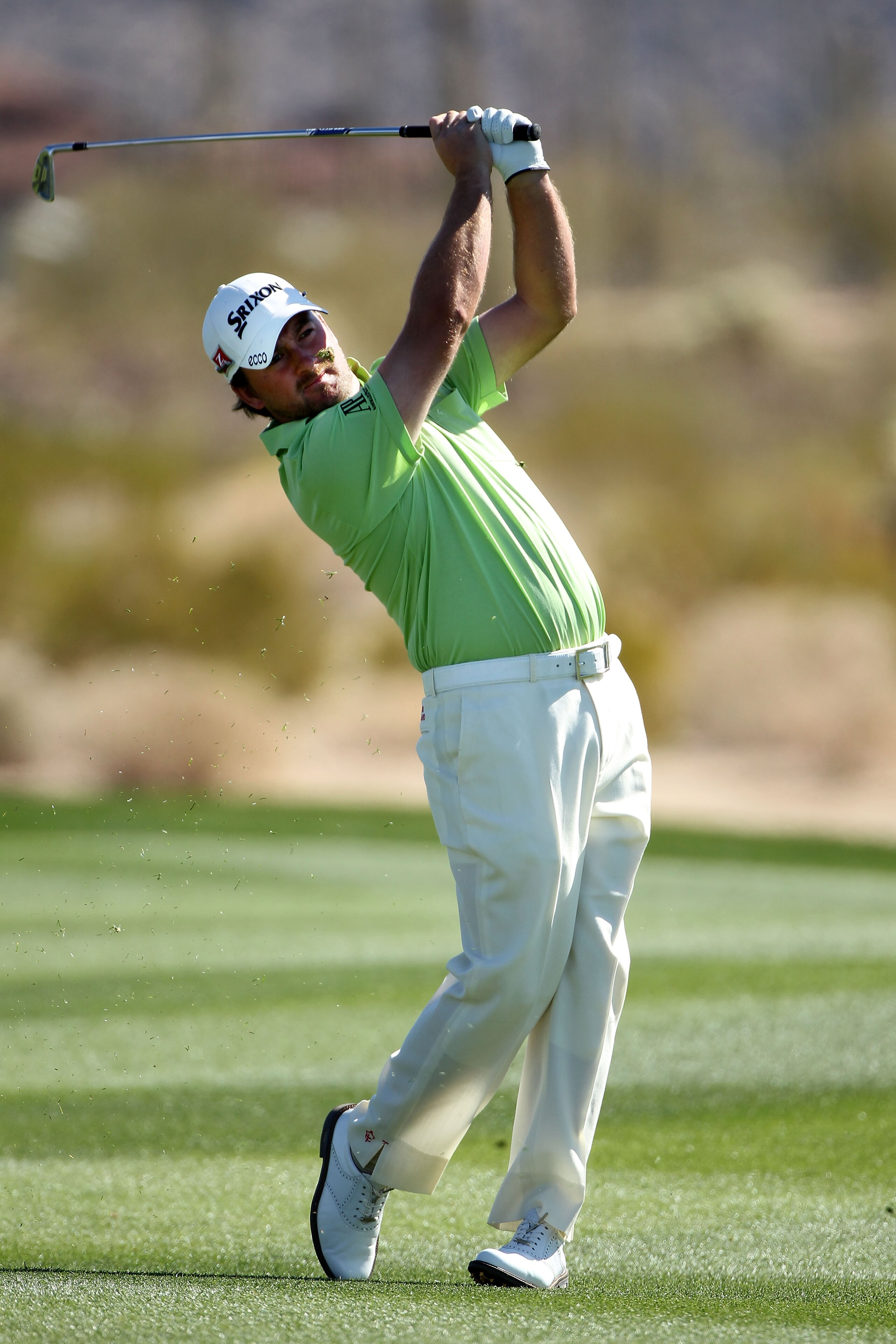 MARANA, AZ - FEBRUARY 25:  Graeme McDowell of Northern Ireland hits his approach shot on the second hole during the third round of the Accenture Match Play Championship at the Ritz-Carlton Golf Club on February 25, 2011 in Marana, Arizona.  (Photo by Andy