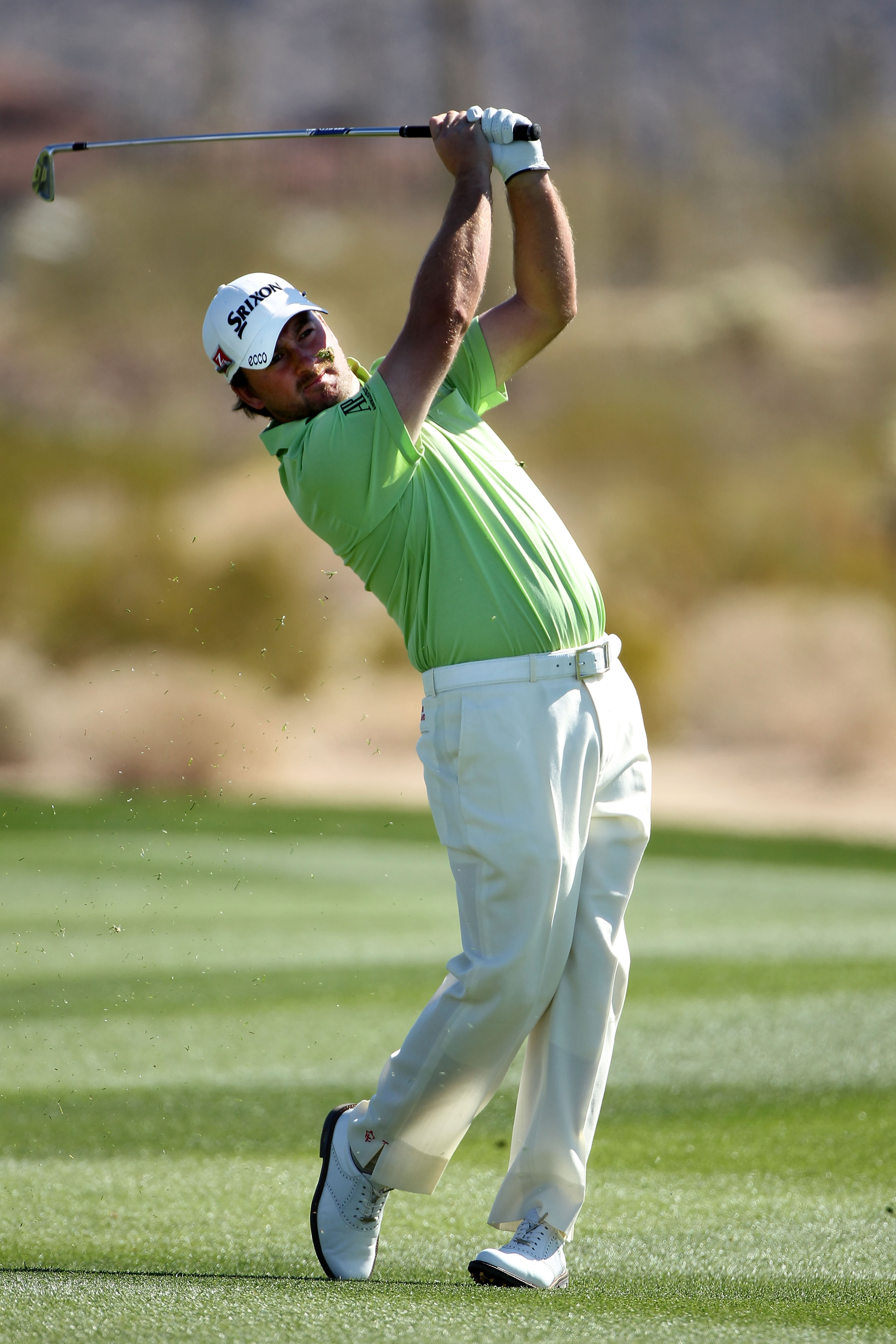 MARANA, AZ - FEBRUARY 25:  Graeme McDowell of Northern Ireland hits his approach shot on the second hole during the third round of the Accenture Match Play Championship at the Ritz-Carlton Golf Club on February 25, 2011 in Marana, Arizona.  (Photo by Andy