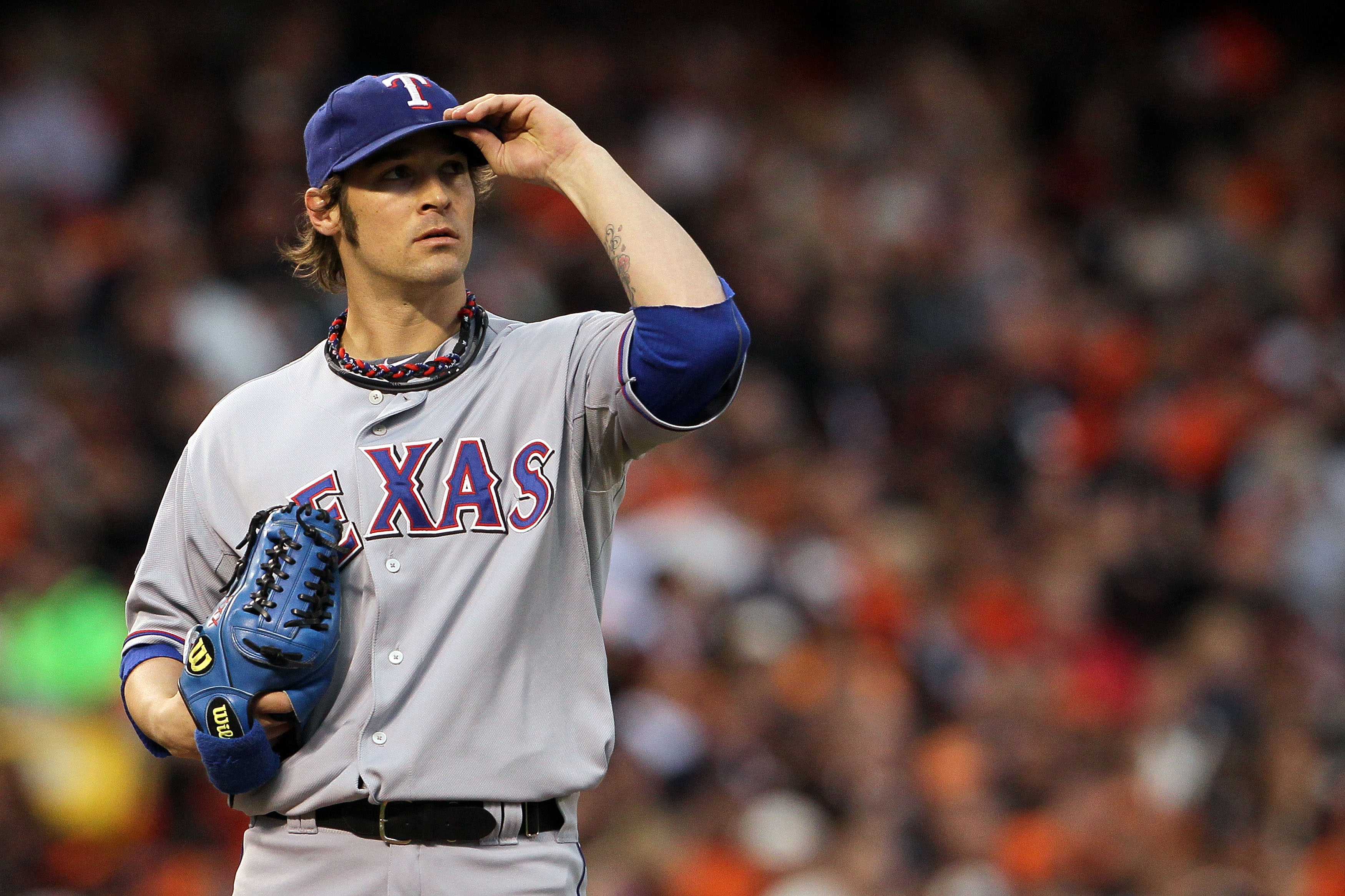 Texas Rangers pitcher Vicente Padilla wipes his face with his