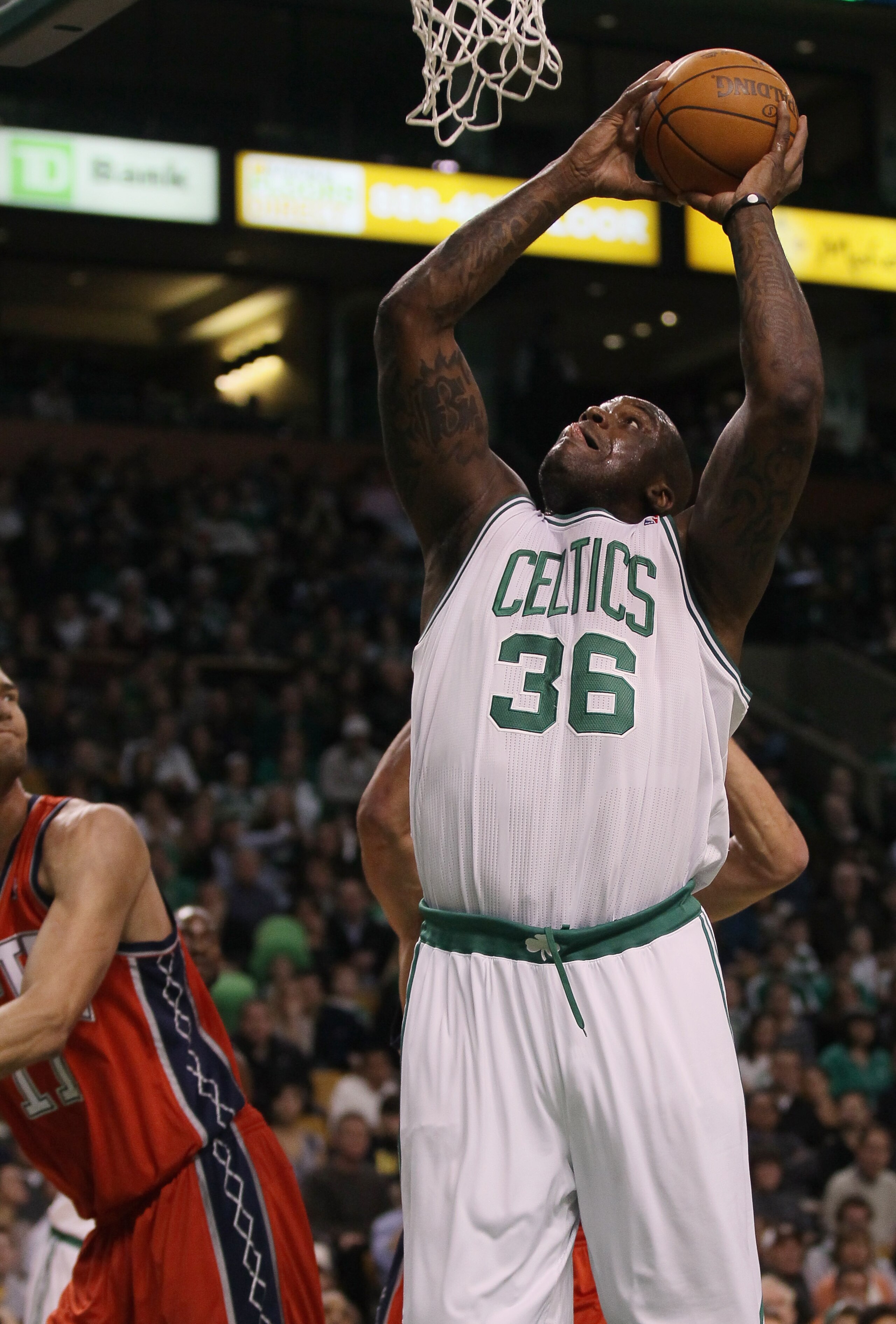 BOSTON - NOVEMBER 24:  Shaquille O'Neal #36 of the Boston Celtics takes a shot in the first half against the New Jersey Nets on November 24, 2010 at the TD Garden in Boston, Massachusetts. NOTE TO USER: User expressly acknowledges and agrees that, by down