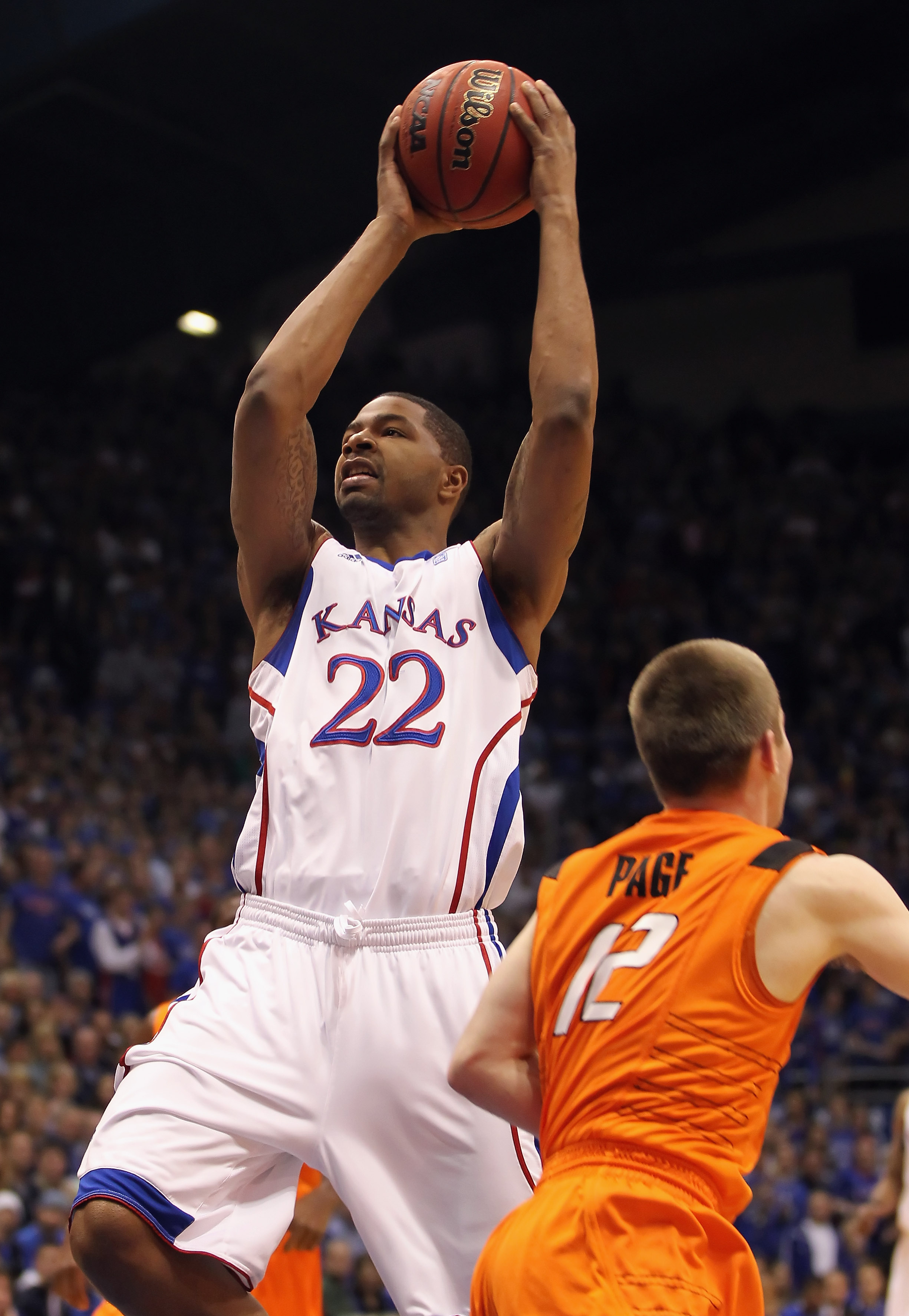 LAWRENCE, KS - FEBRUARY 21: Marcus Morris #22 of the Kansas Jayhawks shoots during the game against the Oklahoma State Cowboys on February 21, 2011 at Allen Fieldhouse in Lawrence, Kansas. (Photo by Jamie Squire/Getty Images)