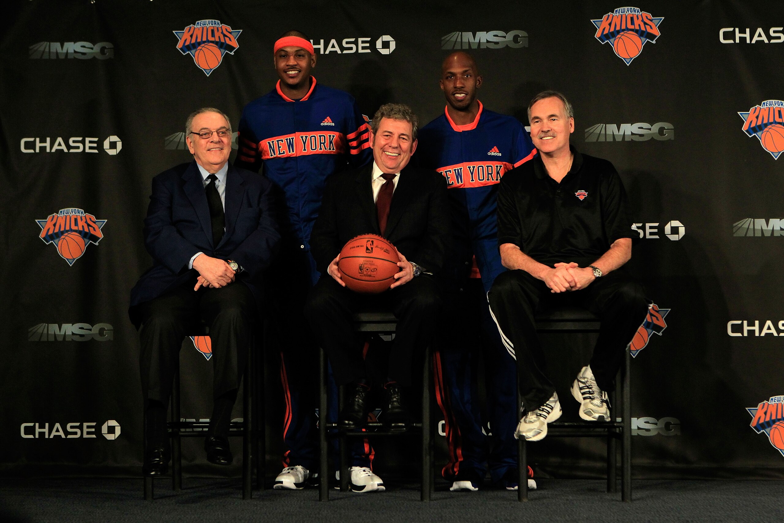 NEW YORK, NY - FEBRUARY 23:  New York Knicks owner (C) Jim Dolan, General Manager Donnie Walsh and Head Coach Mike D'Antoni introduce new players  Carmelo Anthony and Chauncy Phillips at a press conference at Madison Square Garden on February 23, 2011 in