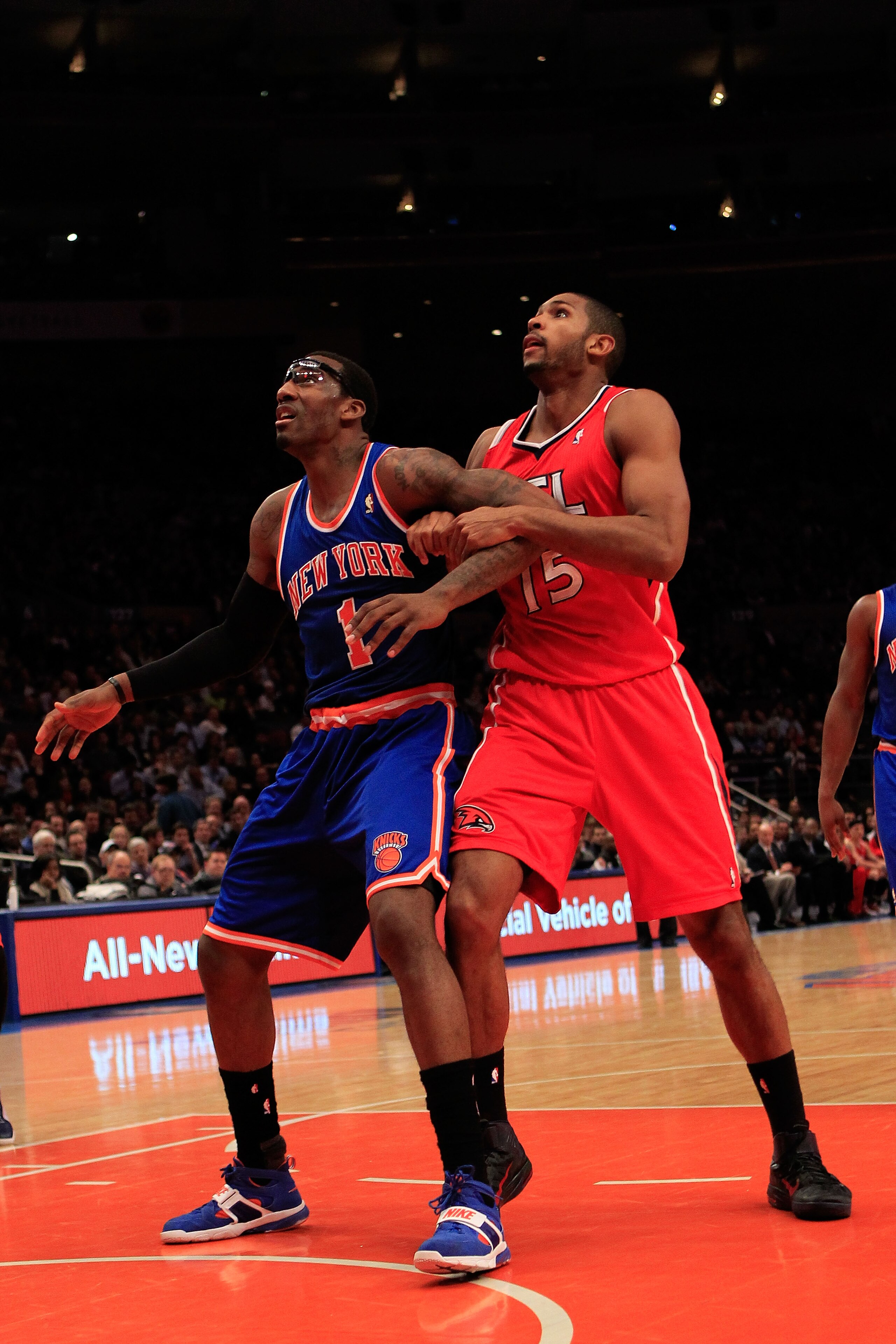 NEW YORK, NY - FEBRUARY 16: (L) Amar'e Stoudemire #1 of the New York Knicks jostles with (R) Al Horford #15 of the Atlanta Hawks for a rebound at Madison Square Garden on February 16, 2011 in New York City. NOTE TO USER: User expressly acknowledges and ag
