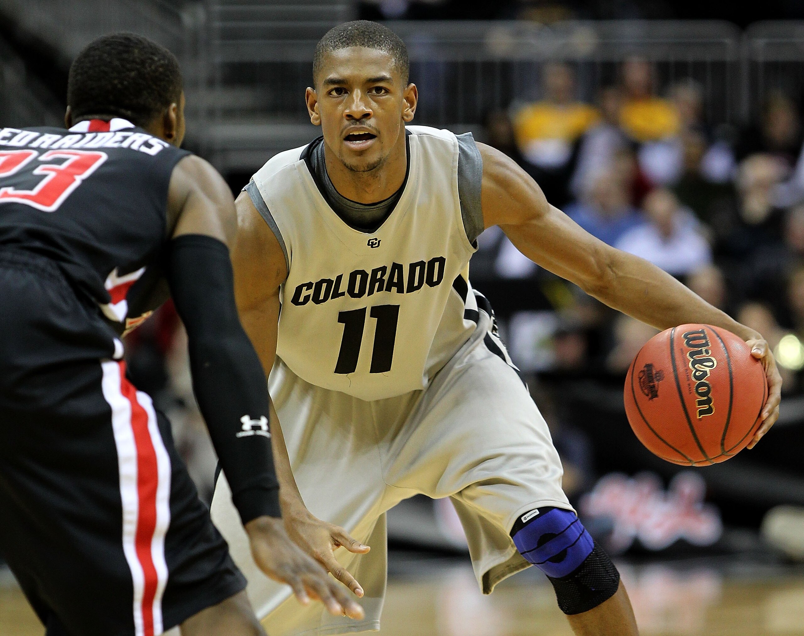 KANSAS CITY, MO - MARCH 10:  Cory Higgins #11 of the Colorado Buffaloes moves the ball against the Texas Tech Red Raiders in the first half during the first round game of the 2010 Phillips 66 Big 12 Men's Basketball Tournament at the Sprint Center on Marc