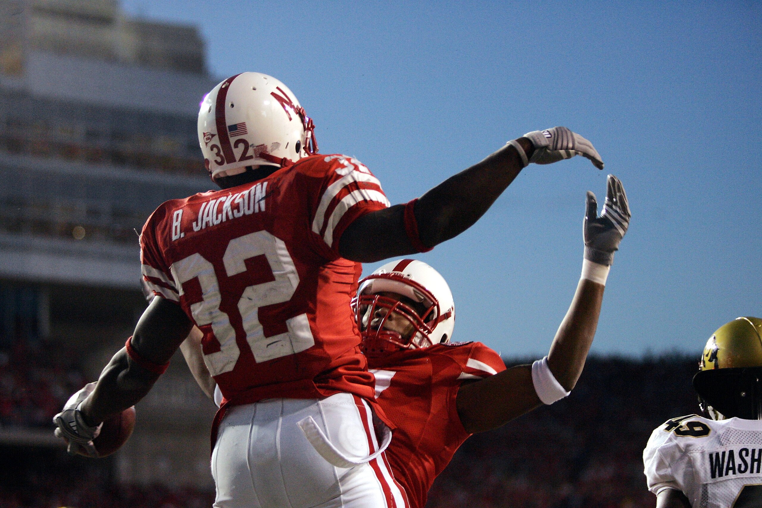LINCOLN, NE - NOVEMBER 24:  Brandon Jackson #32 of the Nebraska Cornhuskers celebrates his touchdown catch with wide receiver Frantz Hardy #7 against the Colorado Buffaloes in the fourth quarter on November 24, 2006 at Memorial Stadium in Lincoln, Nebrask