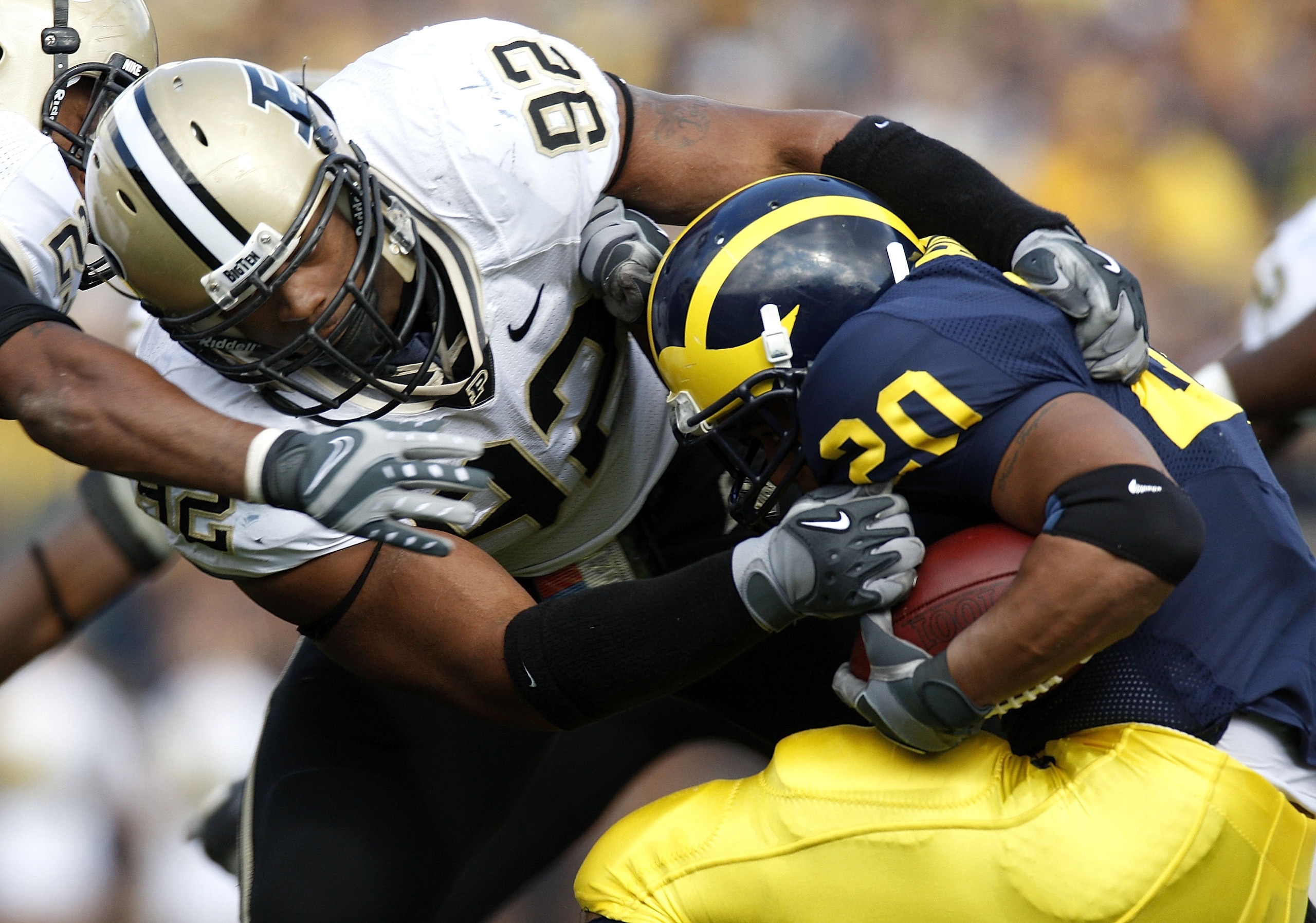 ANN ARBOR, MI - OCTOBER 13:  Mike Neal #92 of the Purdue Boilermakers tries to tackle Mike Hart #20 of the Michigan Wolverines on October 13, 2007 at Michigan Stadium in Ann Arbor, Michigan. (Photo By Gregory Shamus/Getty Images)
