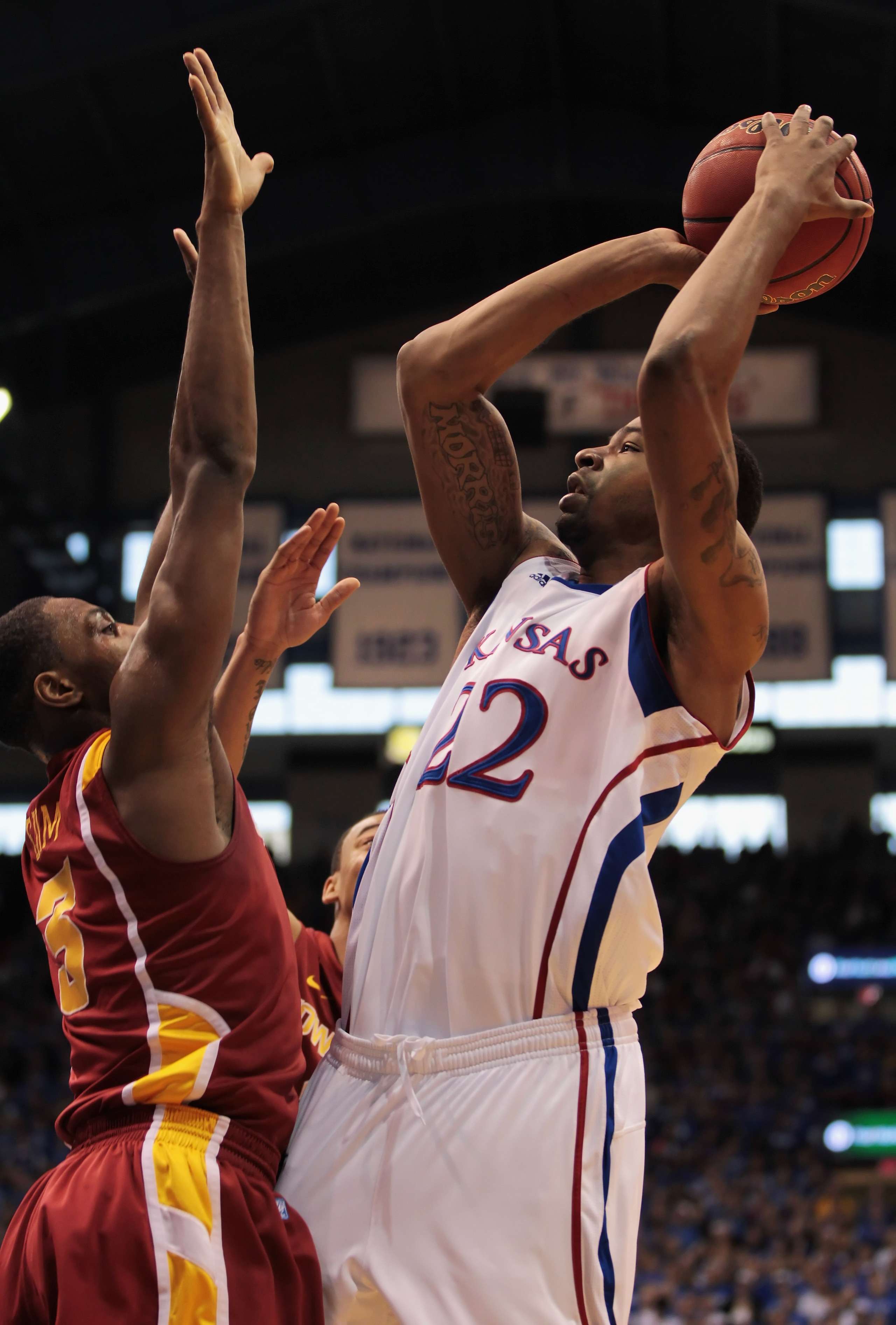 LAWRENCE, KS - FEBRUARY 12:  Marcus Morris #22 of the Kansas Jayhawks shoots over Melvin Ejim #3 of the Iowa State Cyclones during the game on February 12, 2011 at Allen Fieldhouse in Lawrence, Kansas.  (Photo by Jamie Squire/Getty Images)