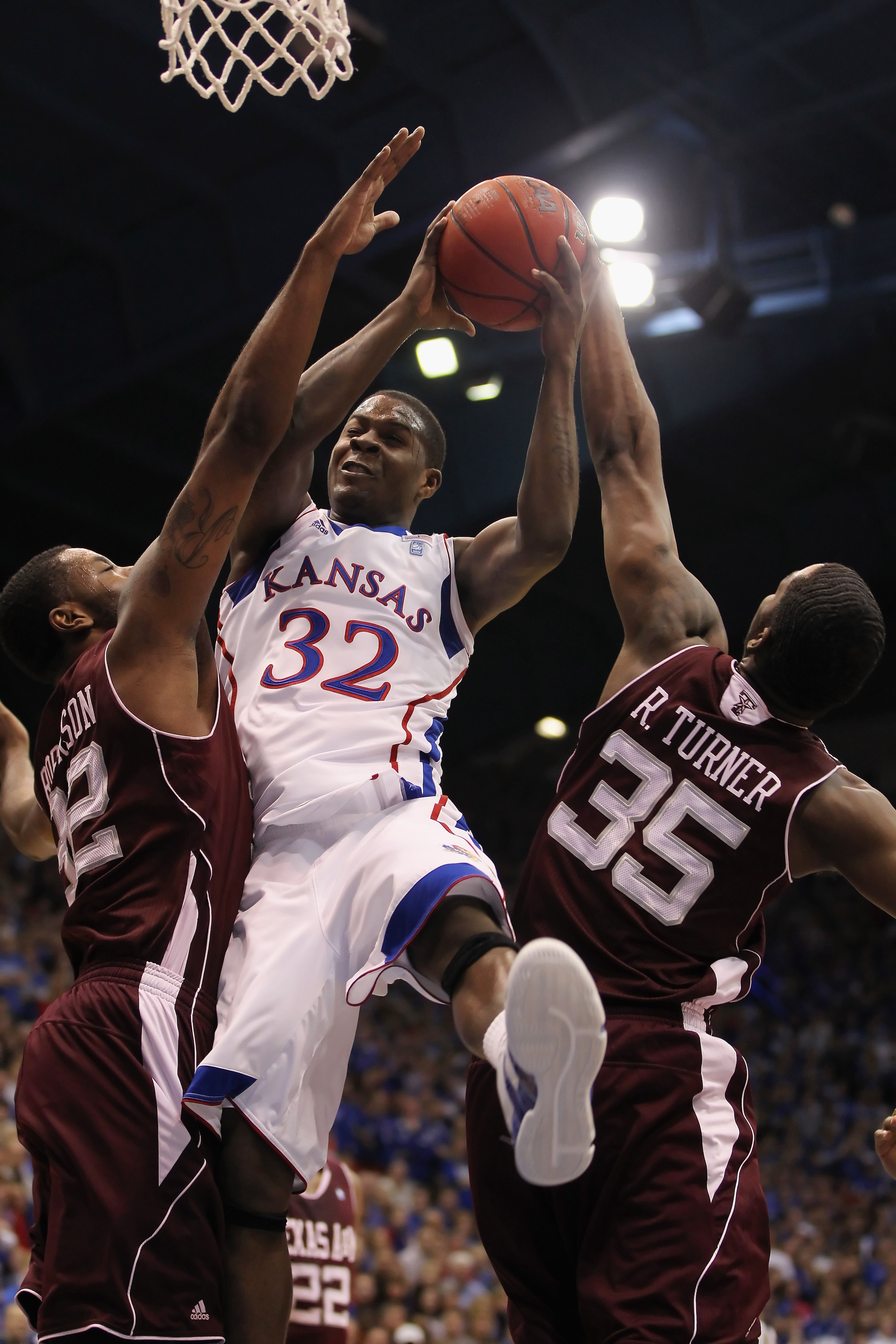 LAWRENCE, KS - MARCH 02:  Josh Selby #32 of the Kansas Jayhawks shoots as Ray Turner #35 the Texas A&M Aggies blocks during the game on March 2, 2011 at Allen Fieldhouse in Lawrence, Kansas.  (Photo by Jamie Squire/Getty Images)