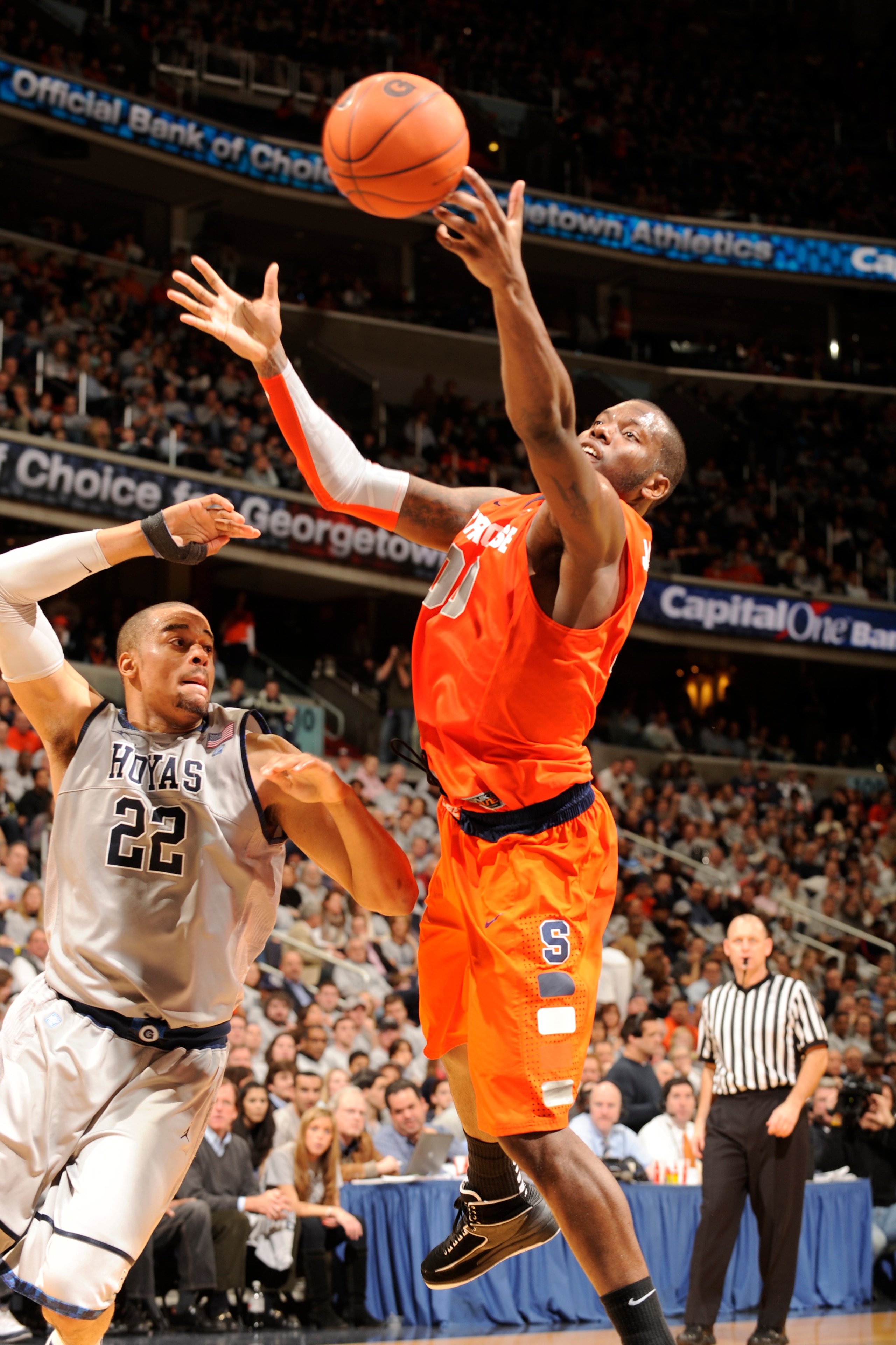 WASHINGTON, DC - FEBRUARY 26:  Rick Jackson #00 of the Syracuse Orange goes after a loose ball against Julian Vaughn #22 of the Georgetown Hoyas on February 26, 2011 at the Verizon Center in Washington, DC  The Orange 58-51.  (Photo by Mitchell Layton/Get