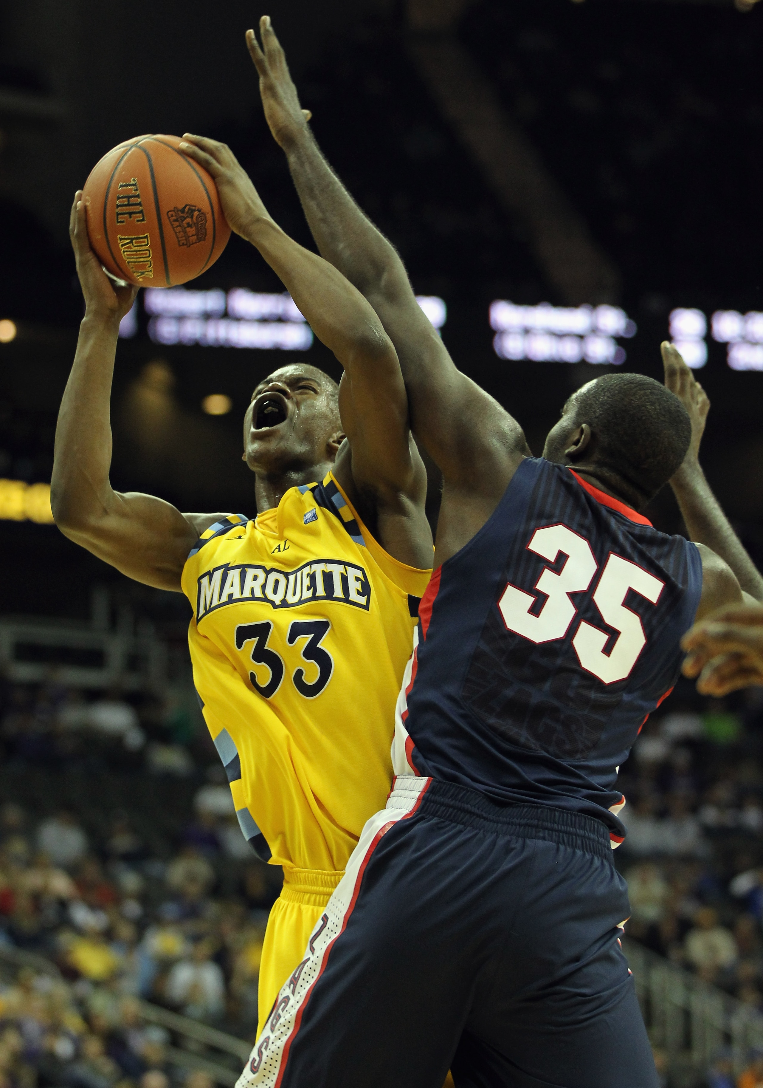 KANSAS CITY, MO - NOVEMBER 23:  Jimmy Butler #33 of the Marquette Golden Eagles shoots over Sam Dower #35 of the Gonzaga Bulldogs during the CBE Classic consolation game on November 23, 2010 at the Sprint Center in Kansas City, Missouri.  (Photo by Jamie 