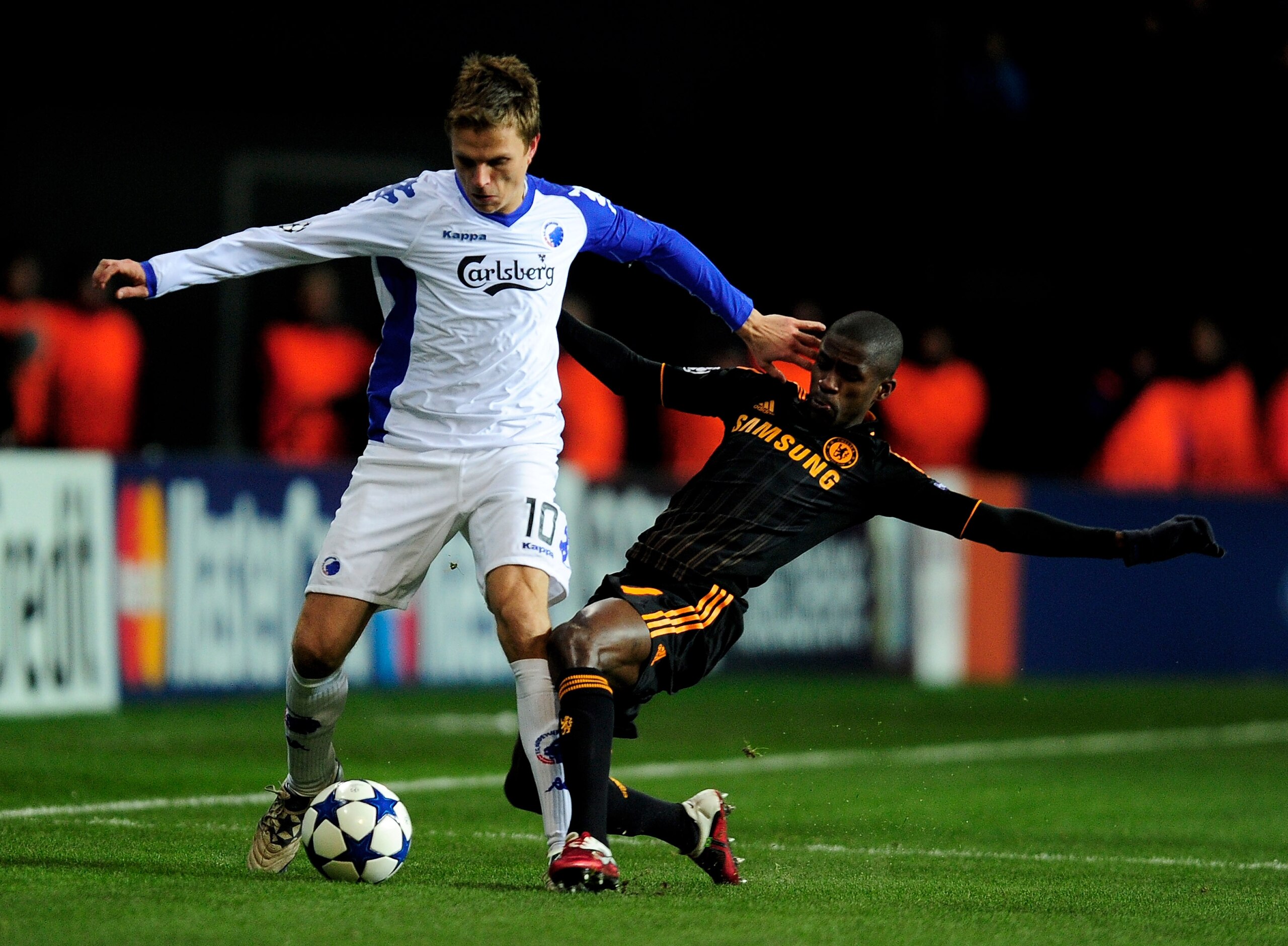 COPENHAGEN, DENMARK - FEBRUARY 22:   Jesper Gronkjaer of FC Copenhagen is tackled by Ramires of Chelsea during  the UEFA Champions League round of 16 first leg match between FC Copenhagen and Chelsea at Parken Stadium on February 22, 2011 in Copenhagen, D