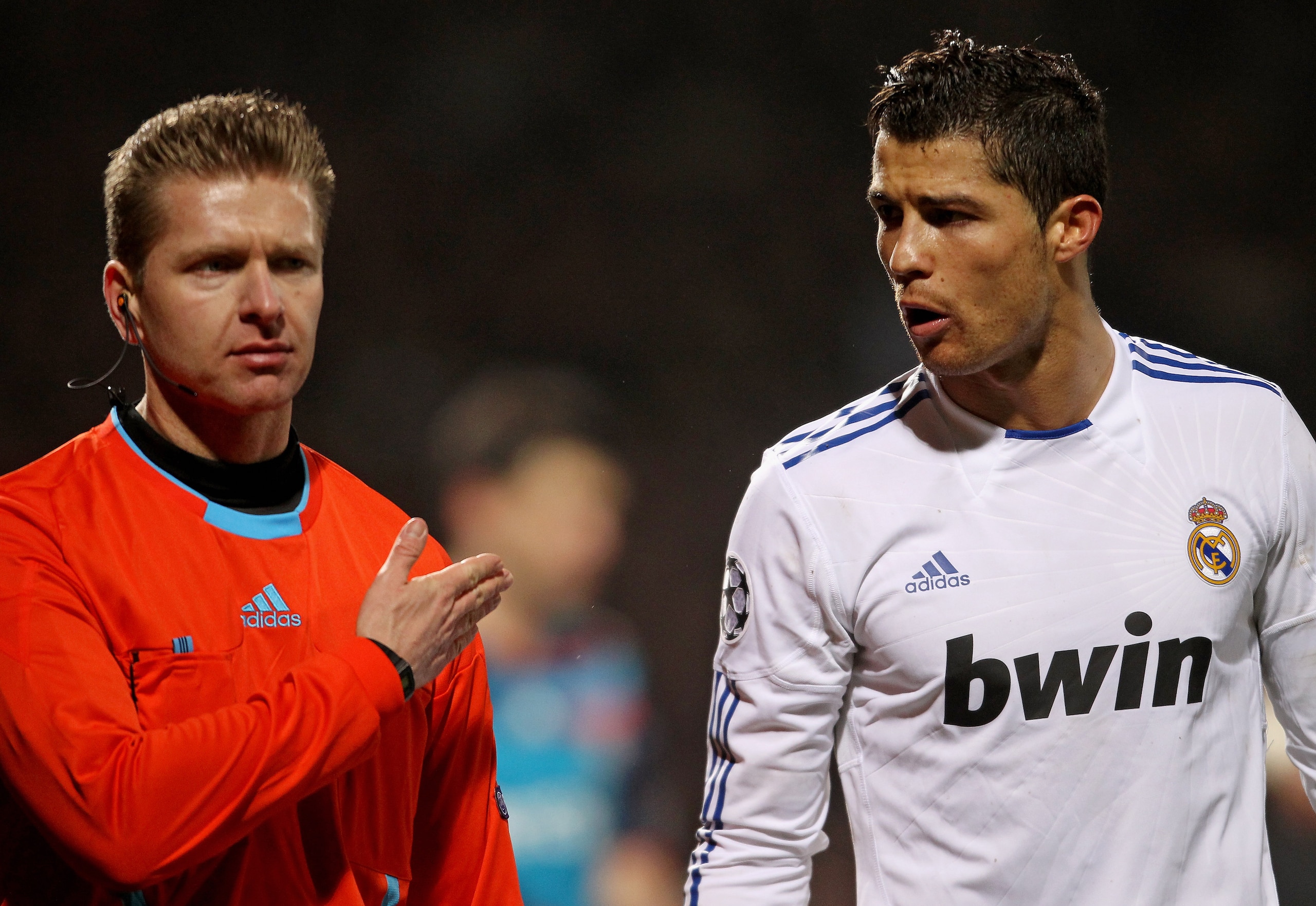 LYON, FRANCE - FEBRUARY 22:  Cristiano Ronlado of Real Madridargues with an assistant referee during the Champions League match between Lyon and Real Madrid at Stade Gerland on February 22, 2011 in Lyon, France.  (Photo by Scott Heavey/Getty Images)