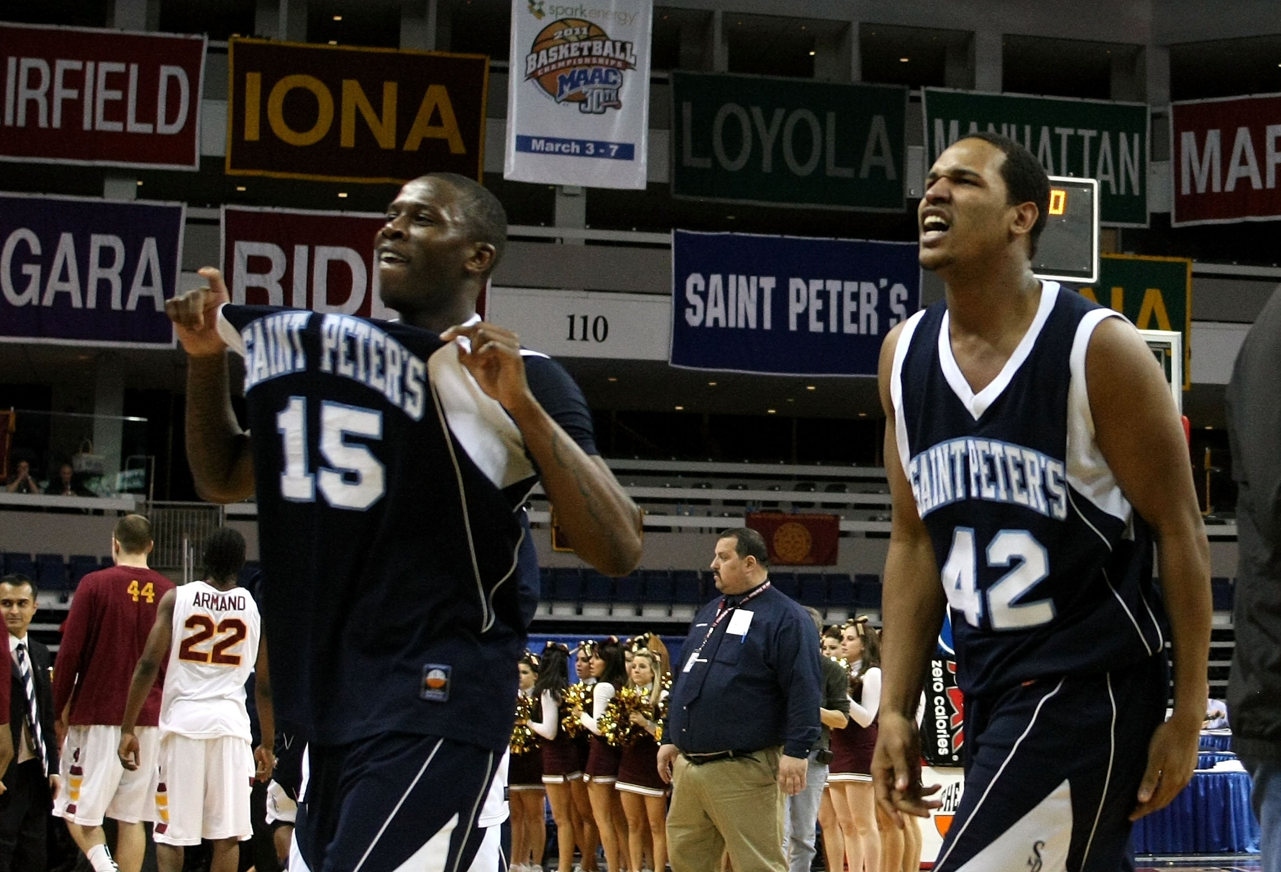 BRIDGEPORT, CT - MARCH 07:  (L-R) Wesley Jenkins #15 and Darius Conley #42 of the St. Peter's Peacocks celebrate after they won 62-57 against the Iona Gaels during the final of the MAAC men's conference basketball tournment at Webster Bank Arena at Harbor